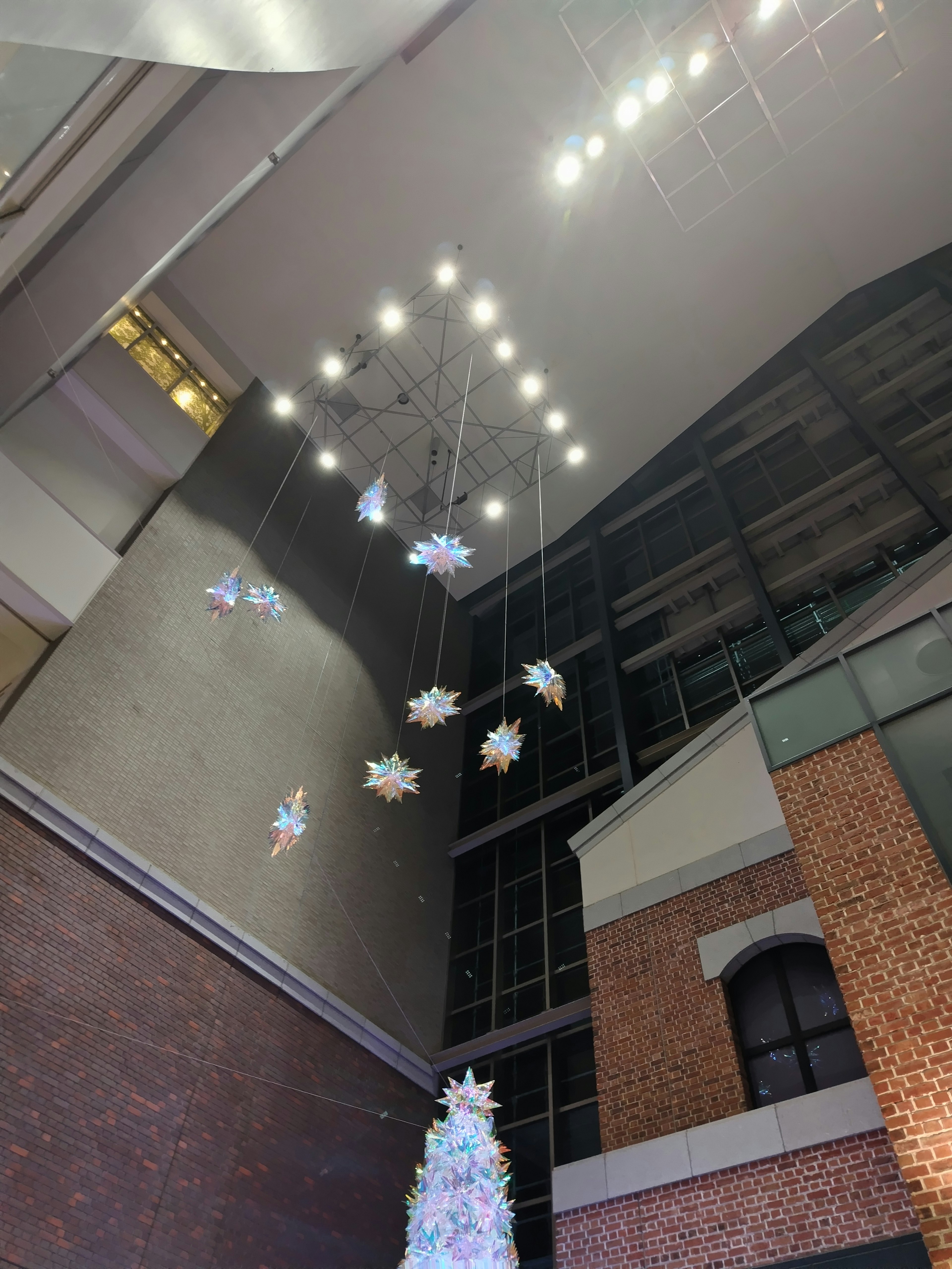 Modern space with white snowflakes hanging from the ceiling and bright lights