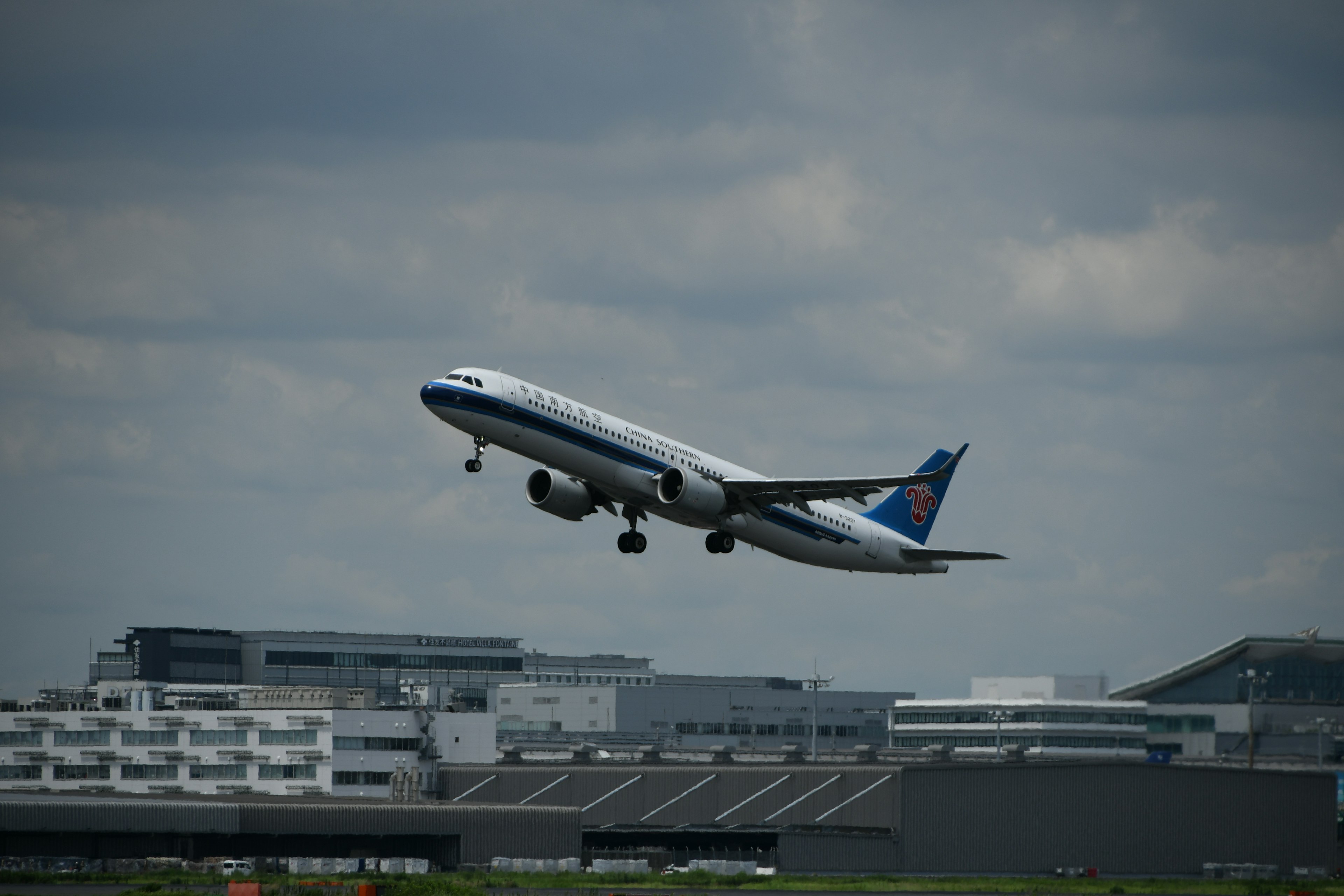 Image of an airplane taking off from an airport