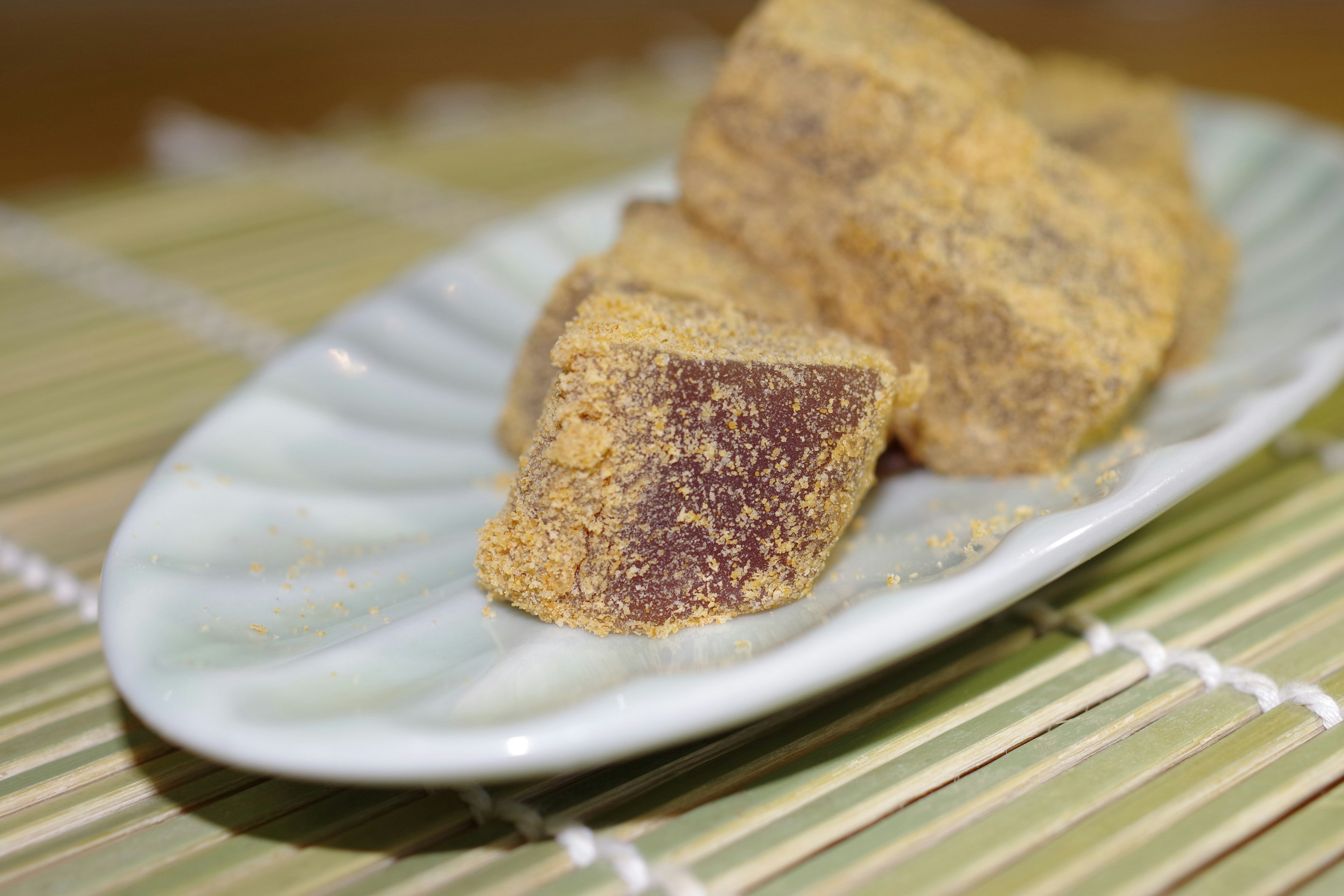 Triangular sweet treats arranged on a white dish