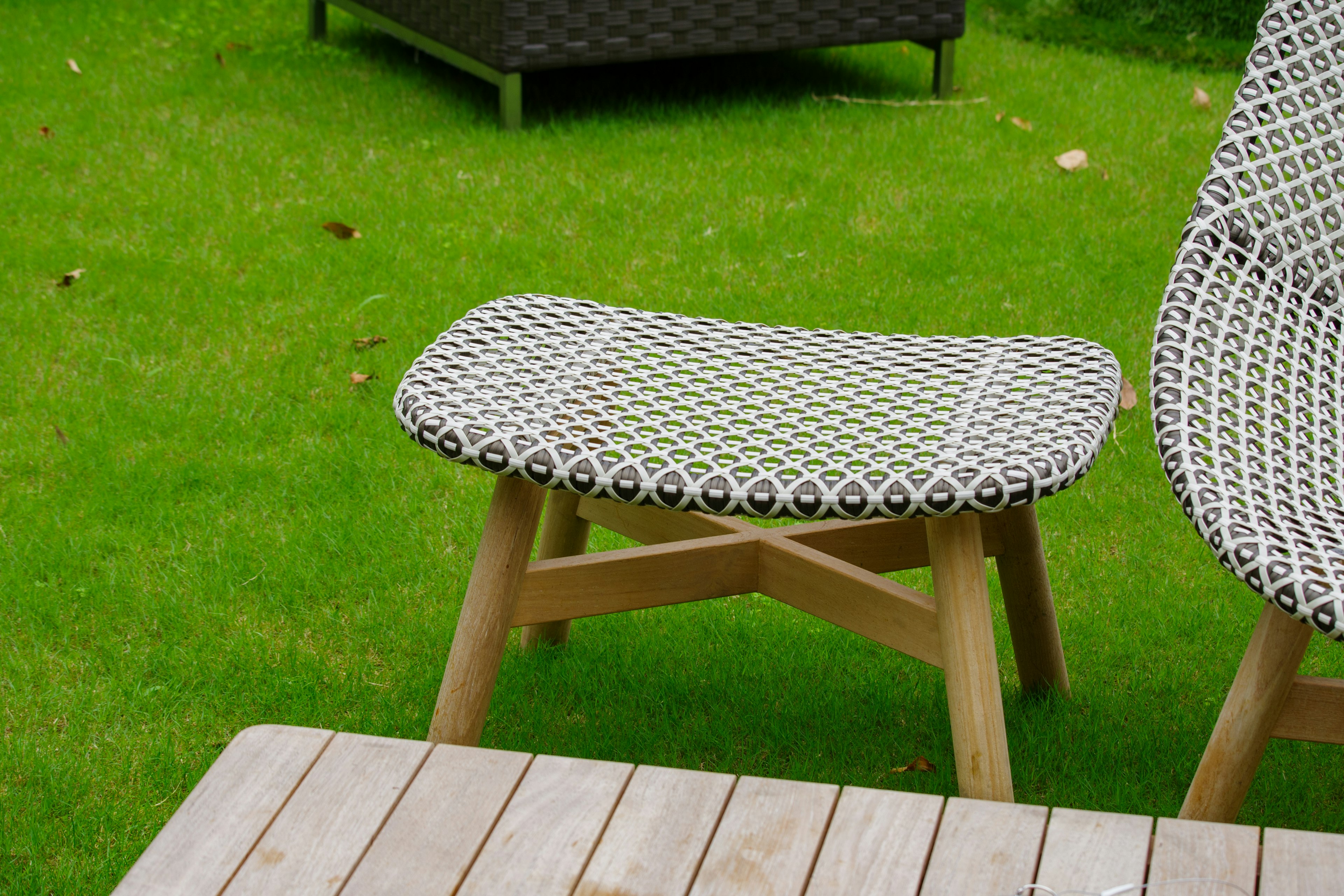 Modern design chair and table on green grass