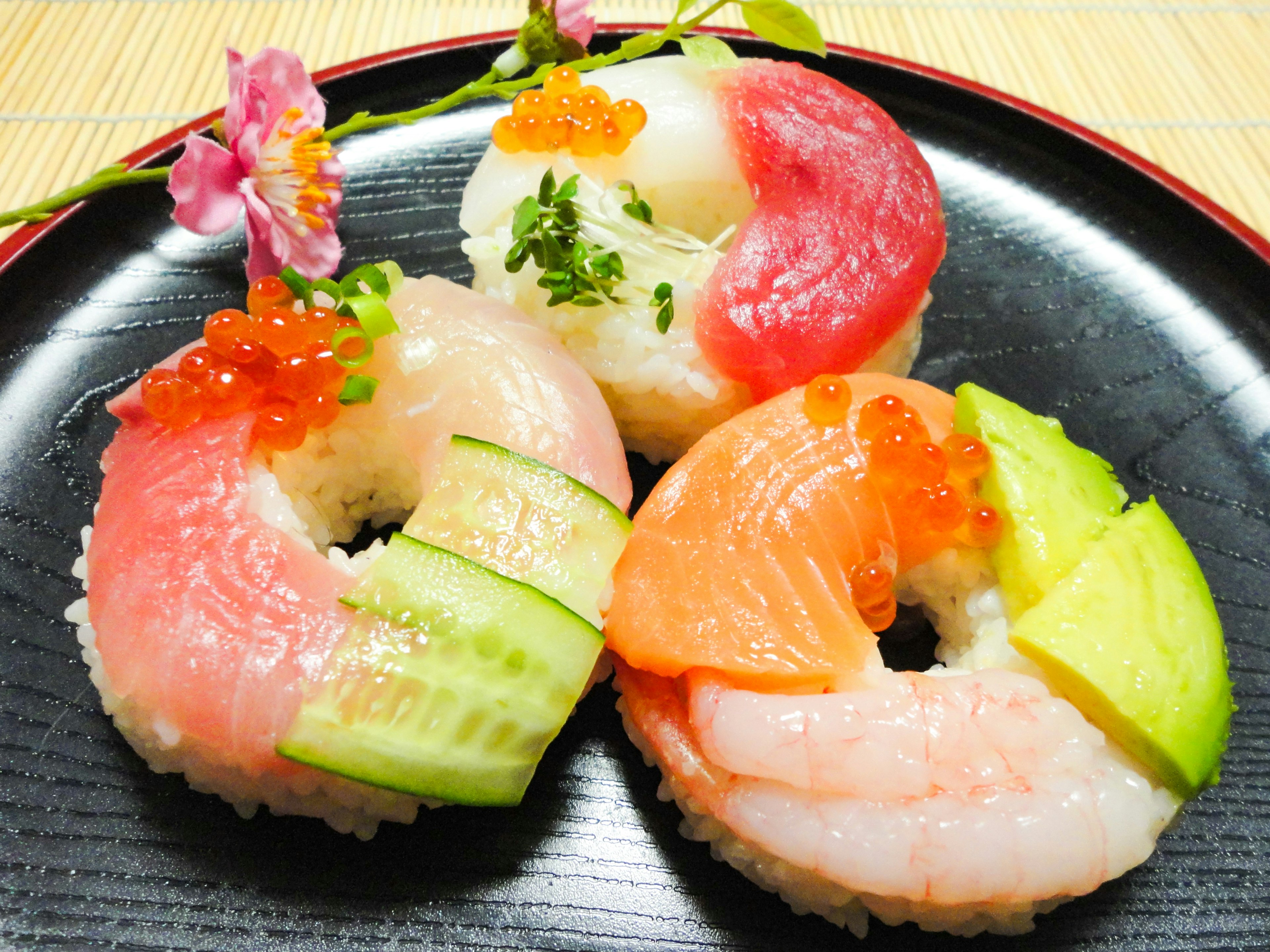 Beautiful sushi platter arranged on a black plate