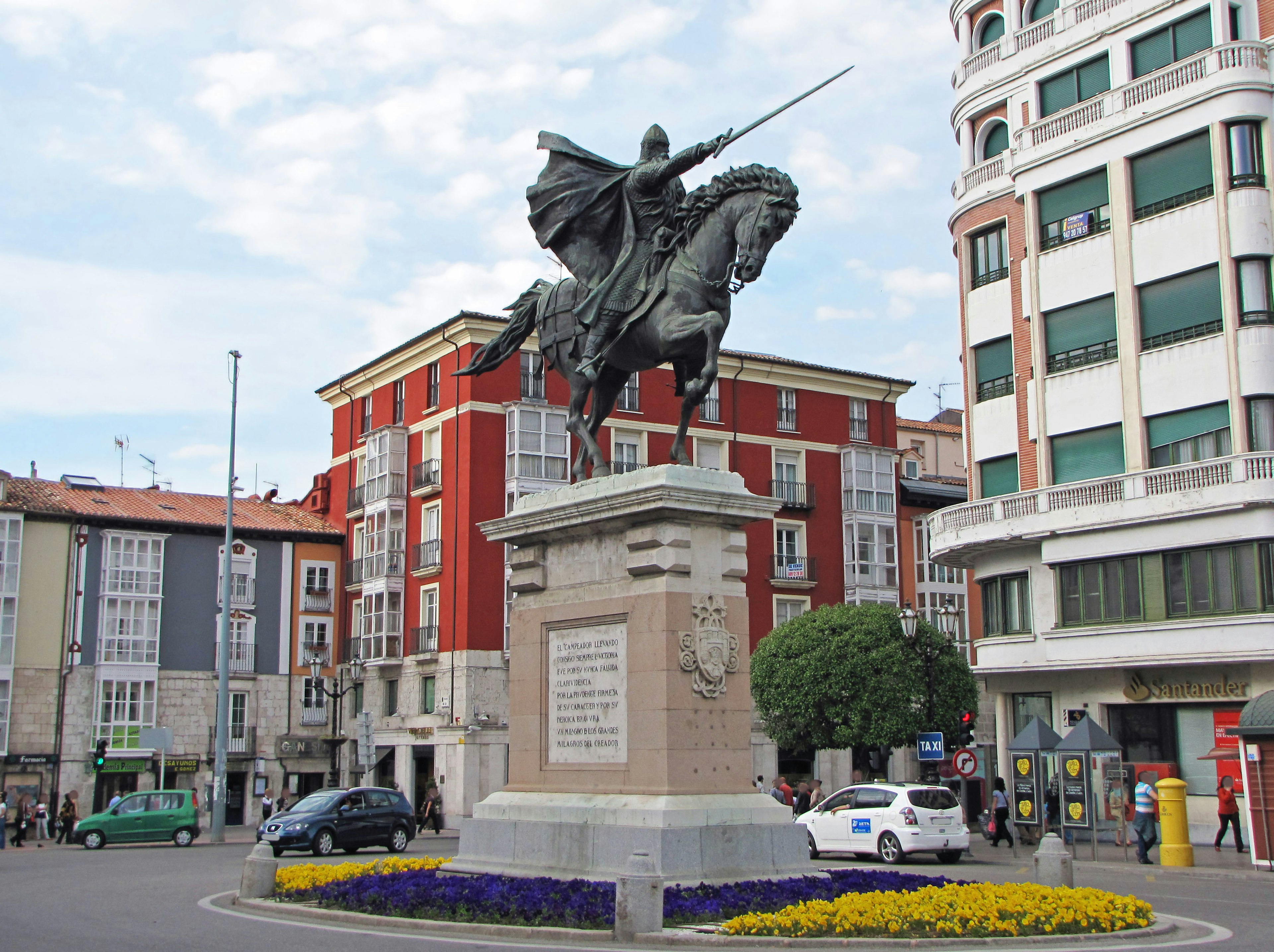 Statue of a knight on horseback in a city square