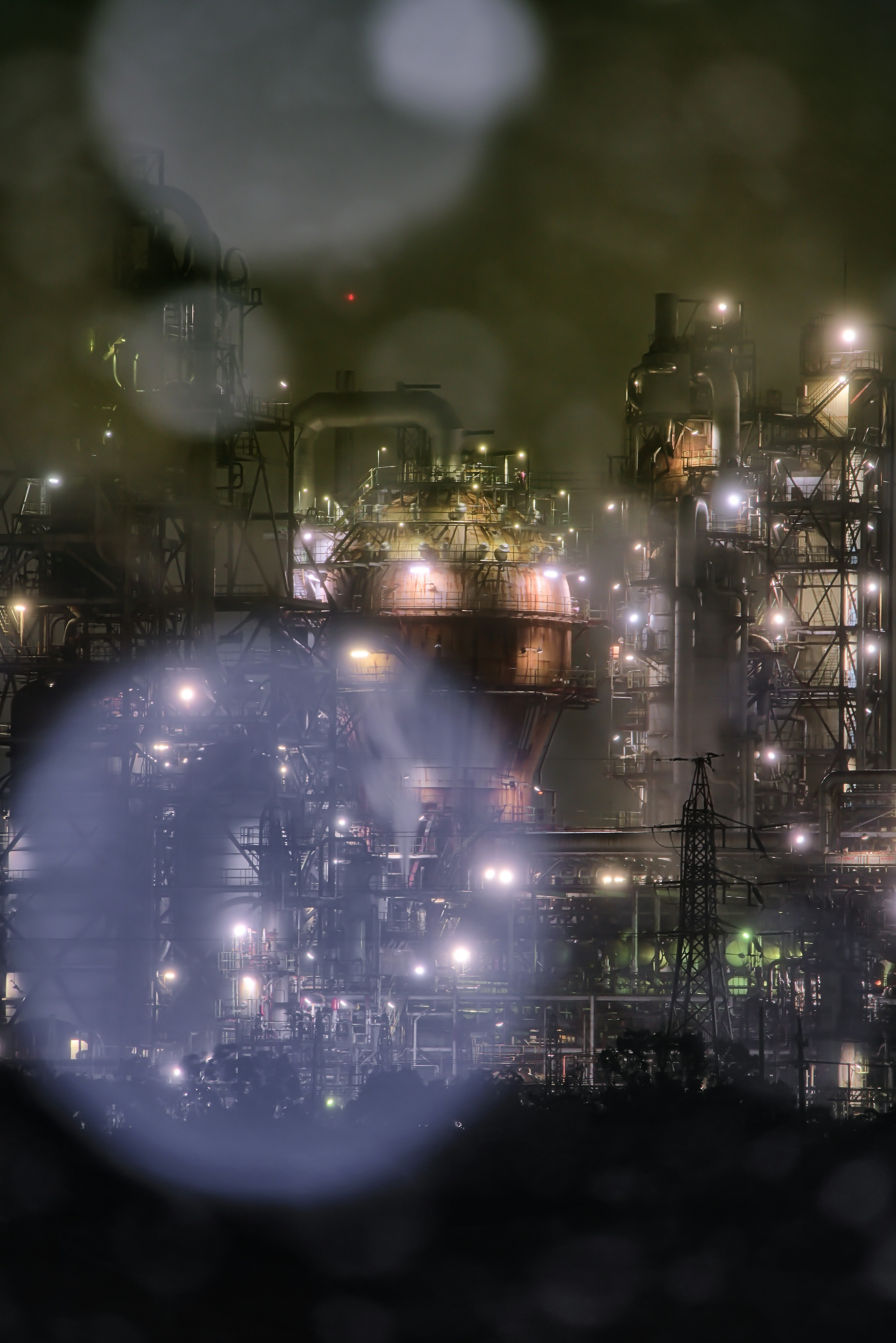 Night view of an industrial area with glowing lights