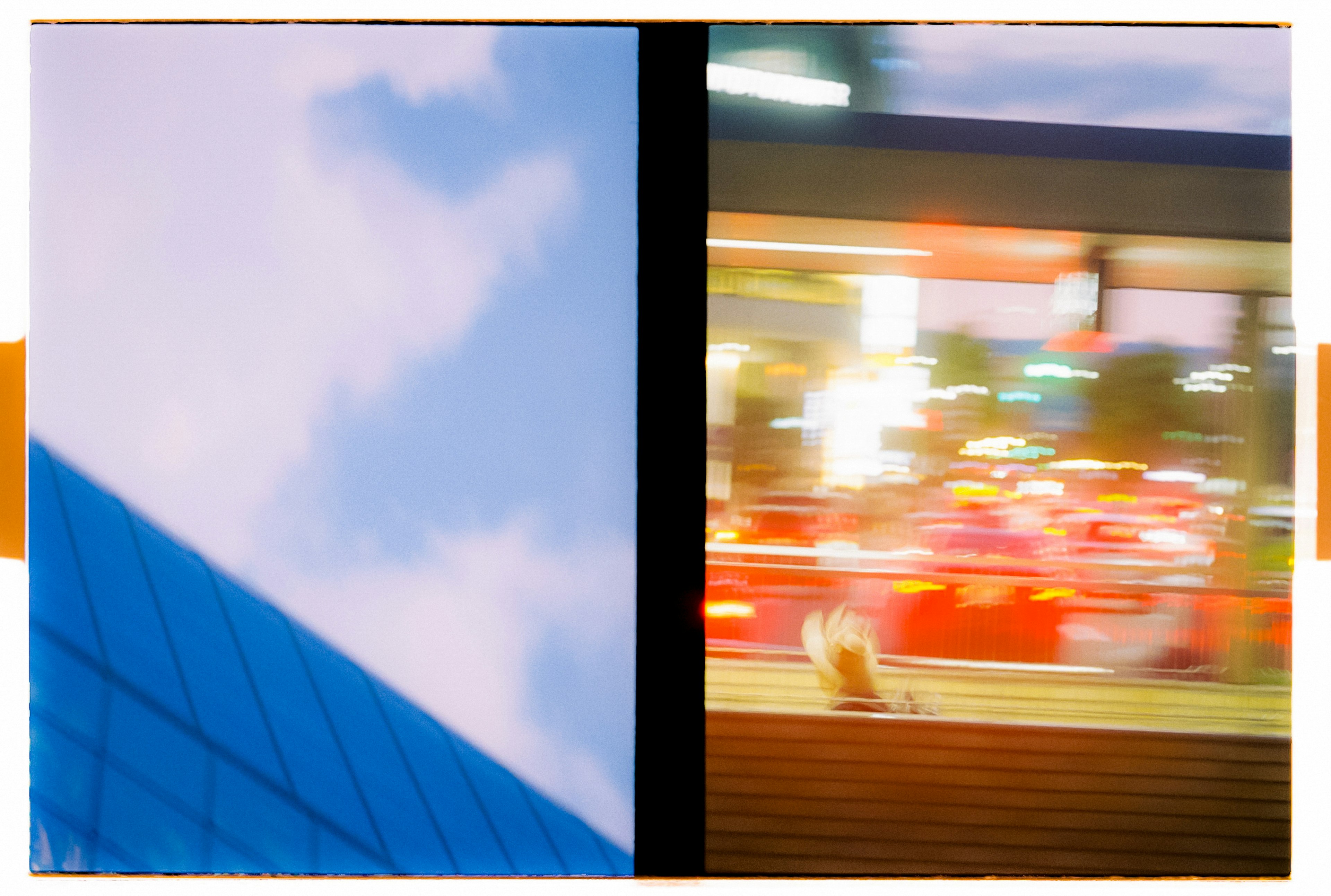 Foto que presenta un cielo azul y parte de un edificio con luces de la ciudad borrosas en el lado derecho