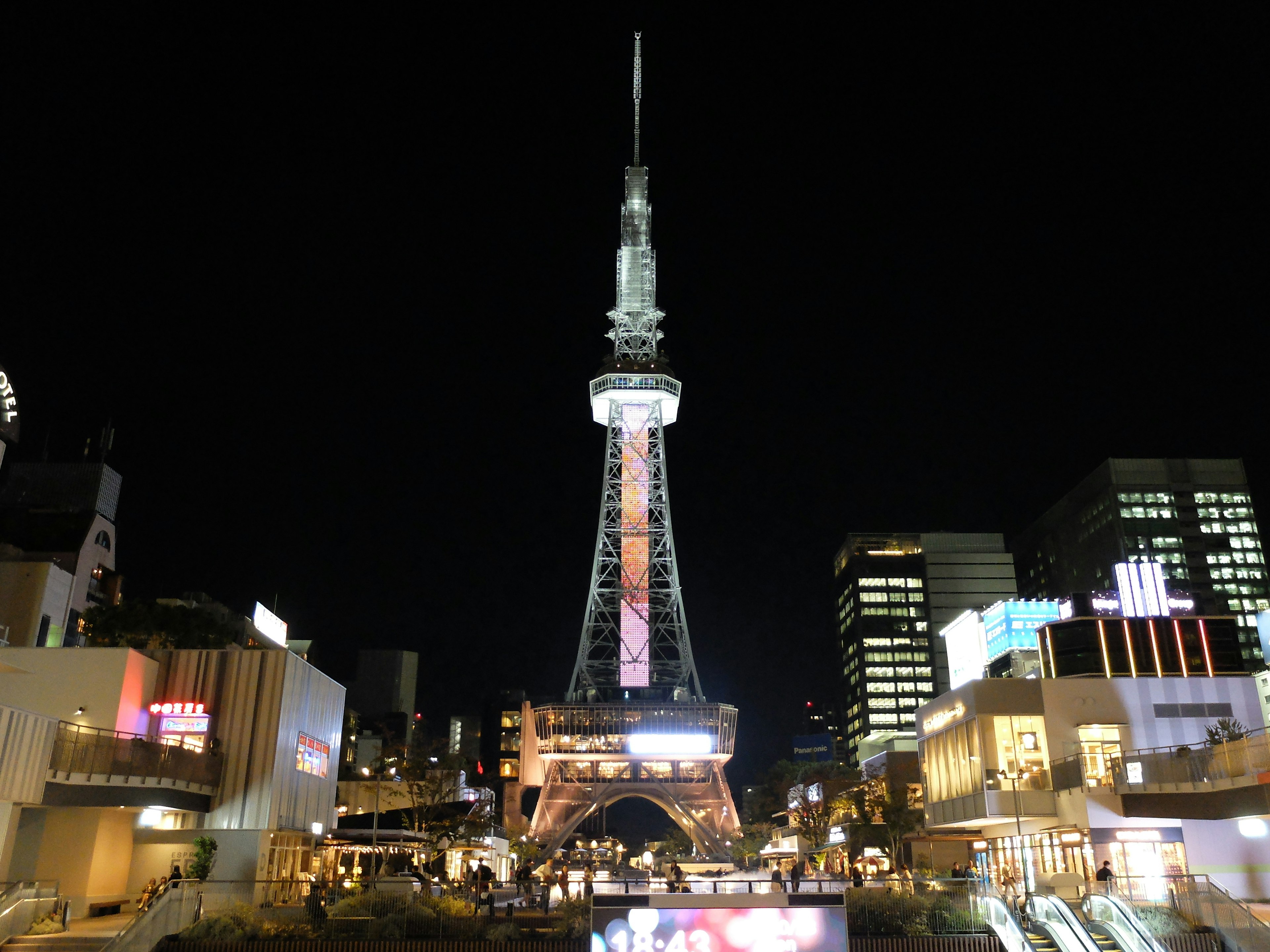 Nagoya TV Tower at night with surrounding buildings