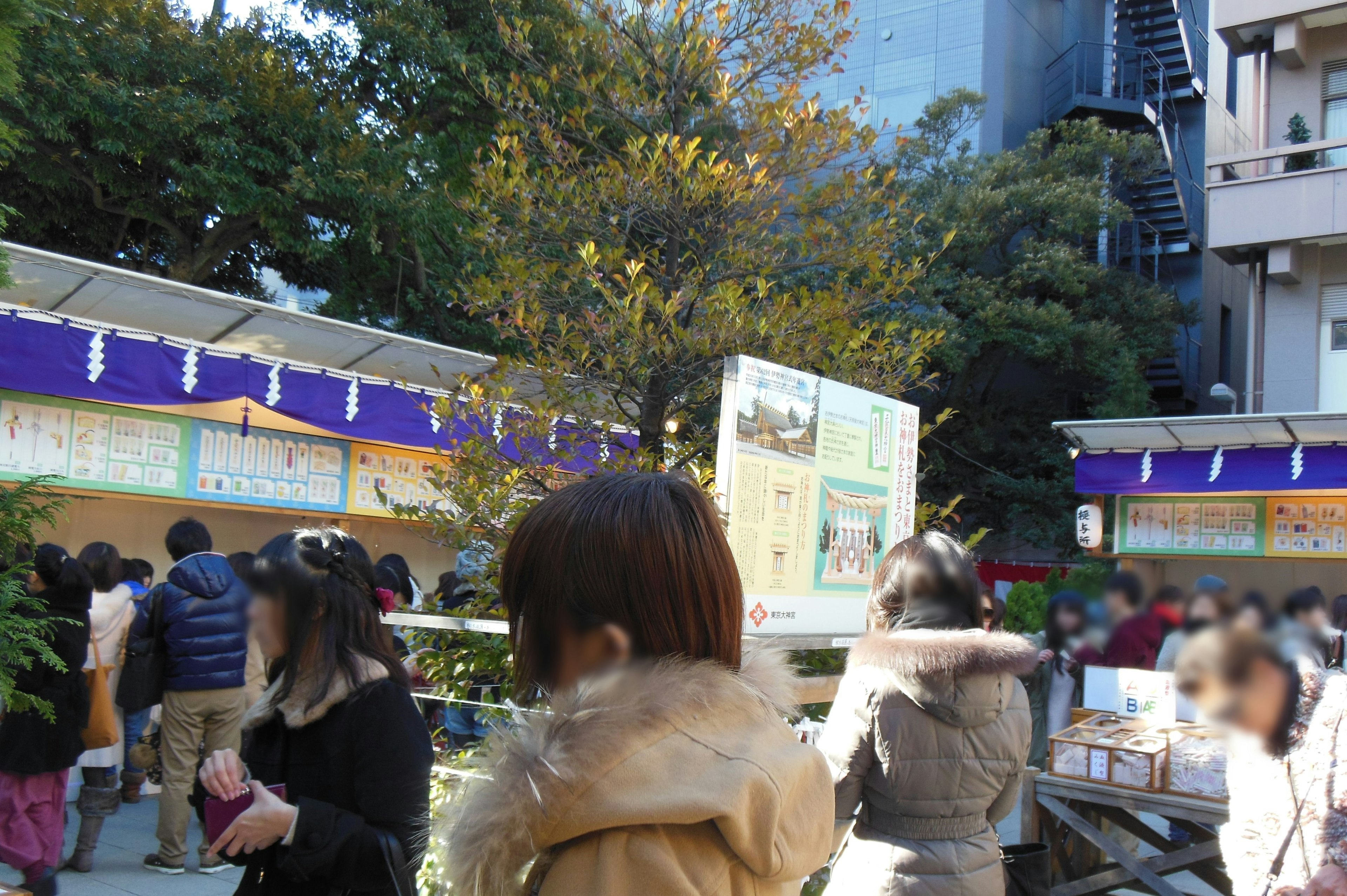 Busy street corner with stalls and lively crowd