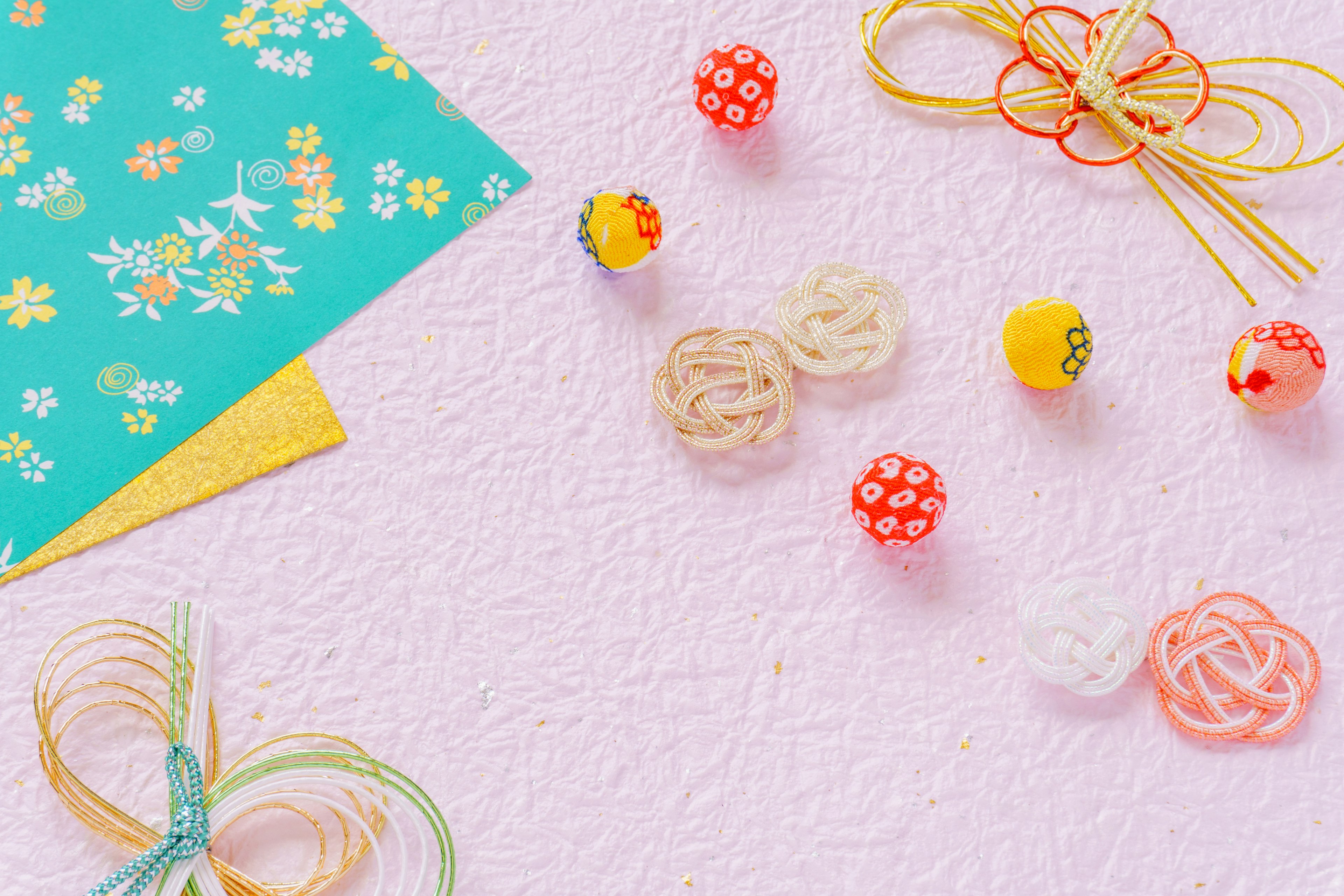 Flat lay of colorful Japanese accessories and floral patterned envelopes