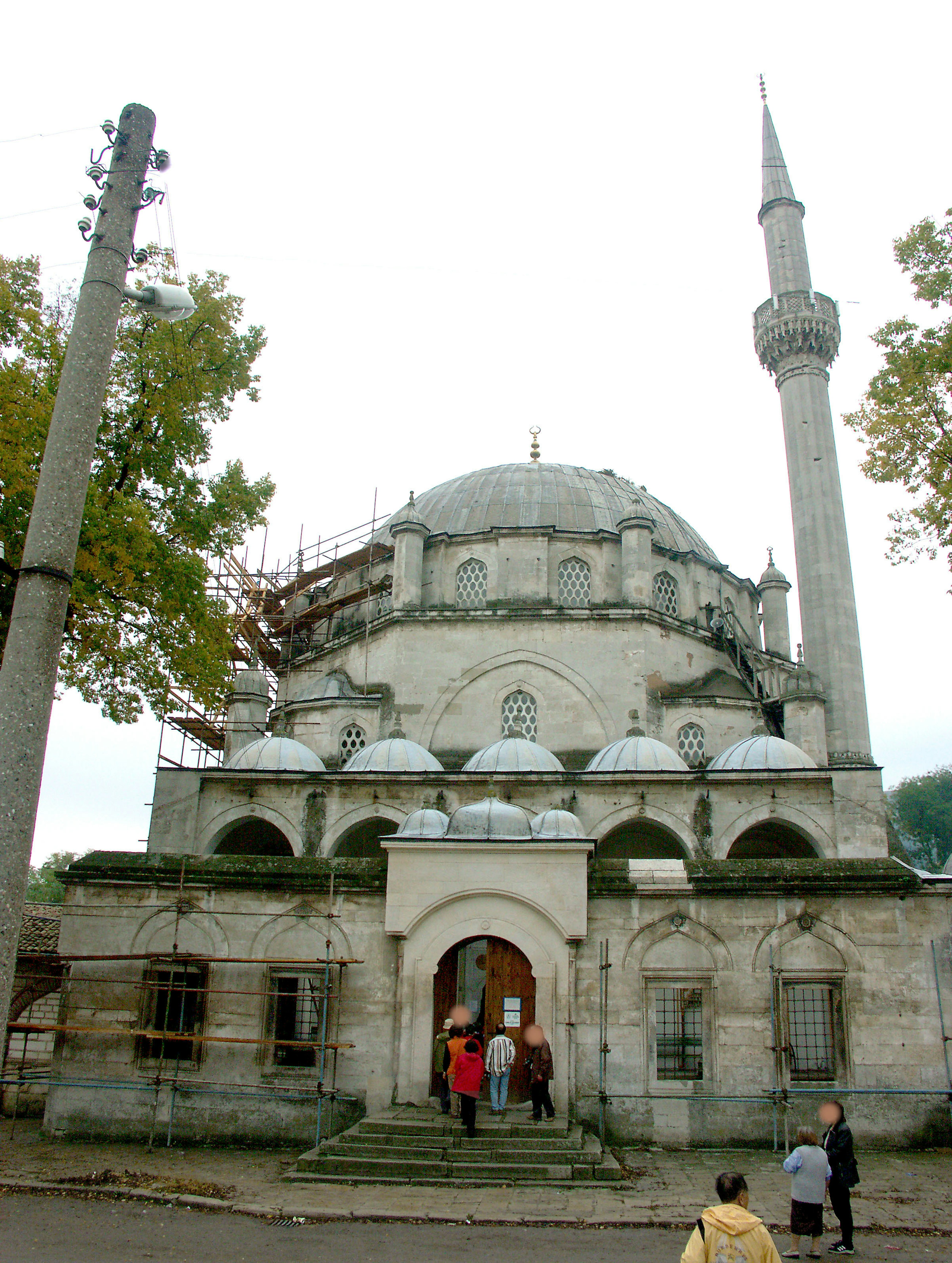 Exterior view of a mosque with visitors