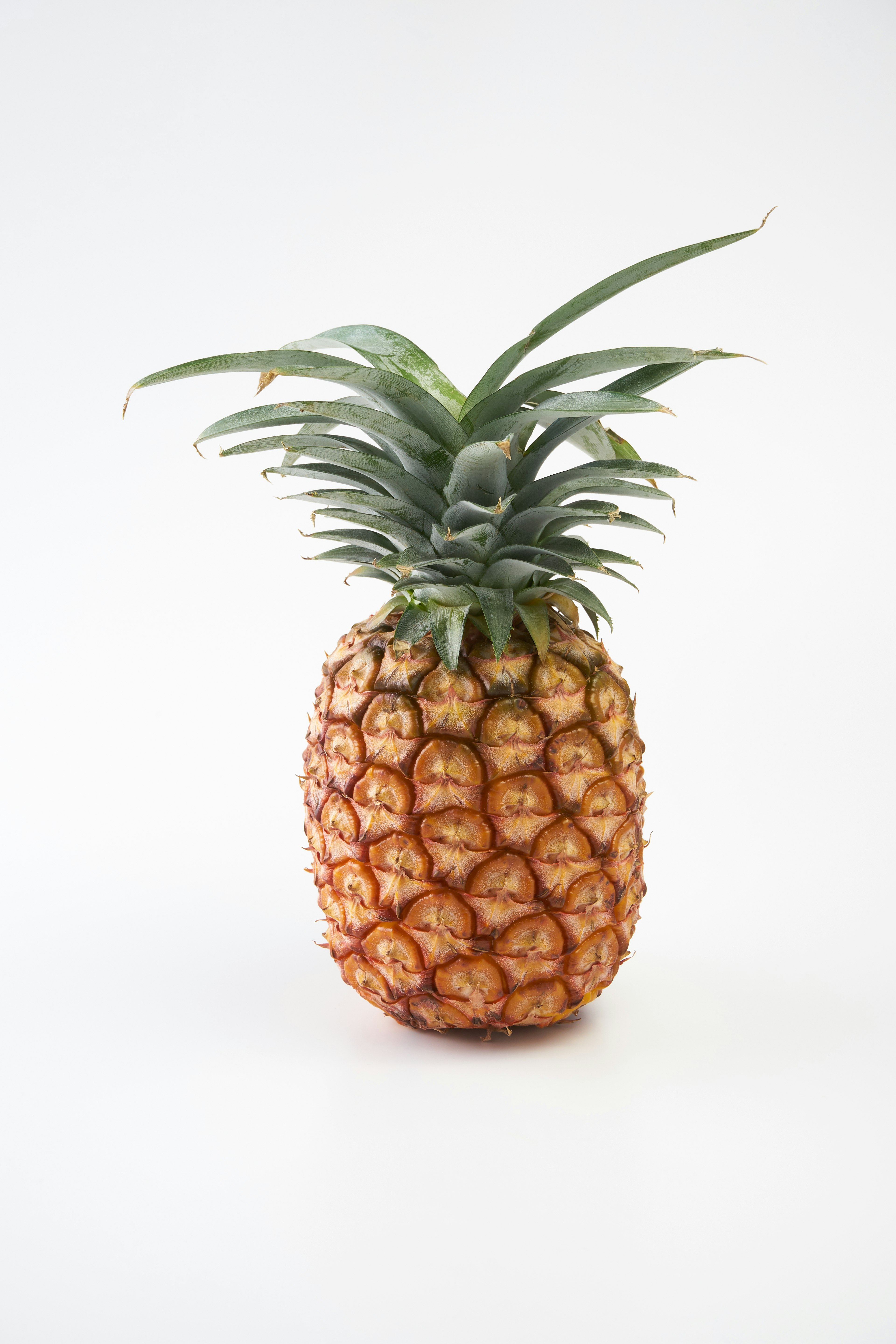 Vibrant pineapple photo standing against a bright background