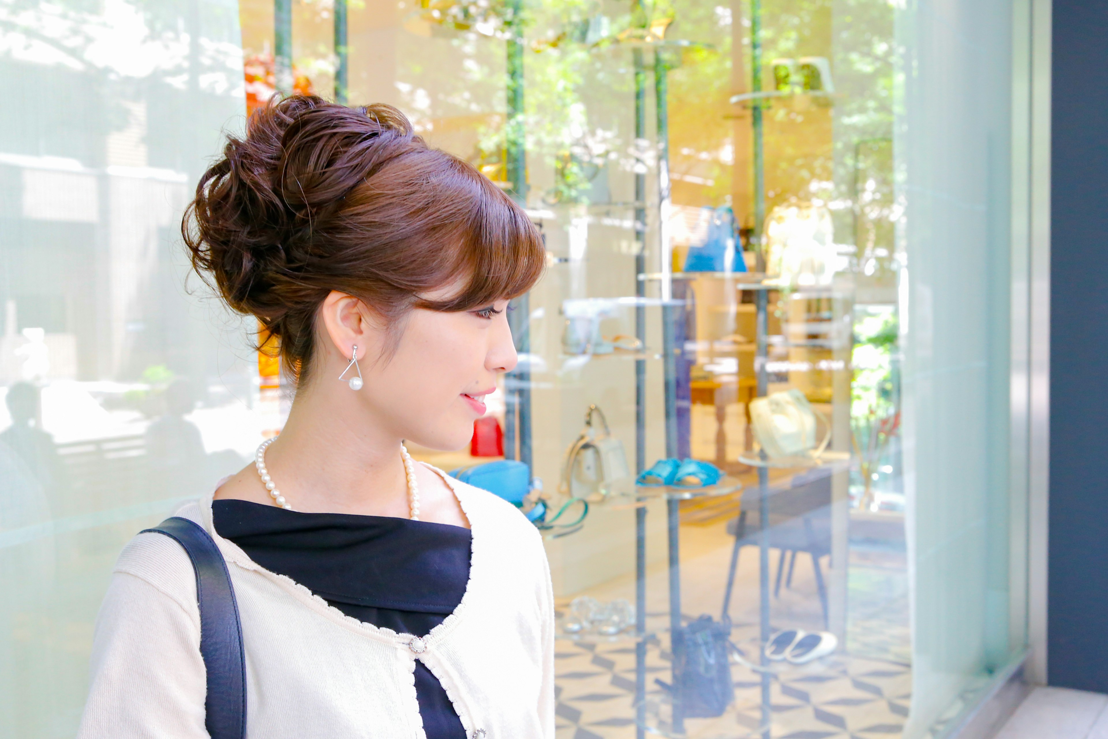 A woman looking out the window stylish hairstyle and fashion