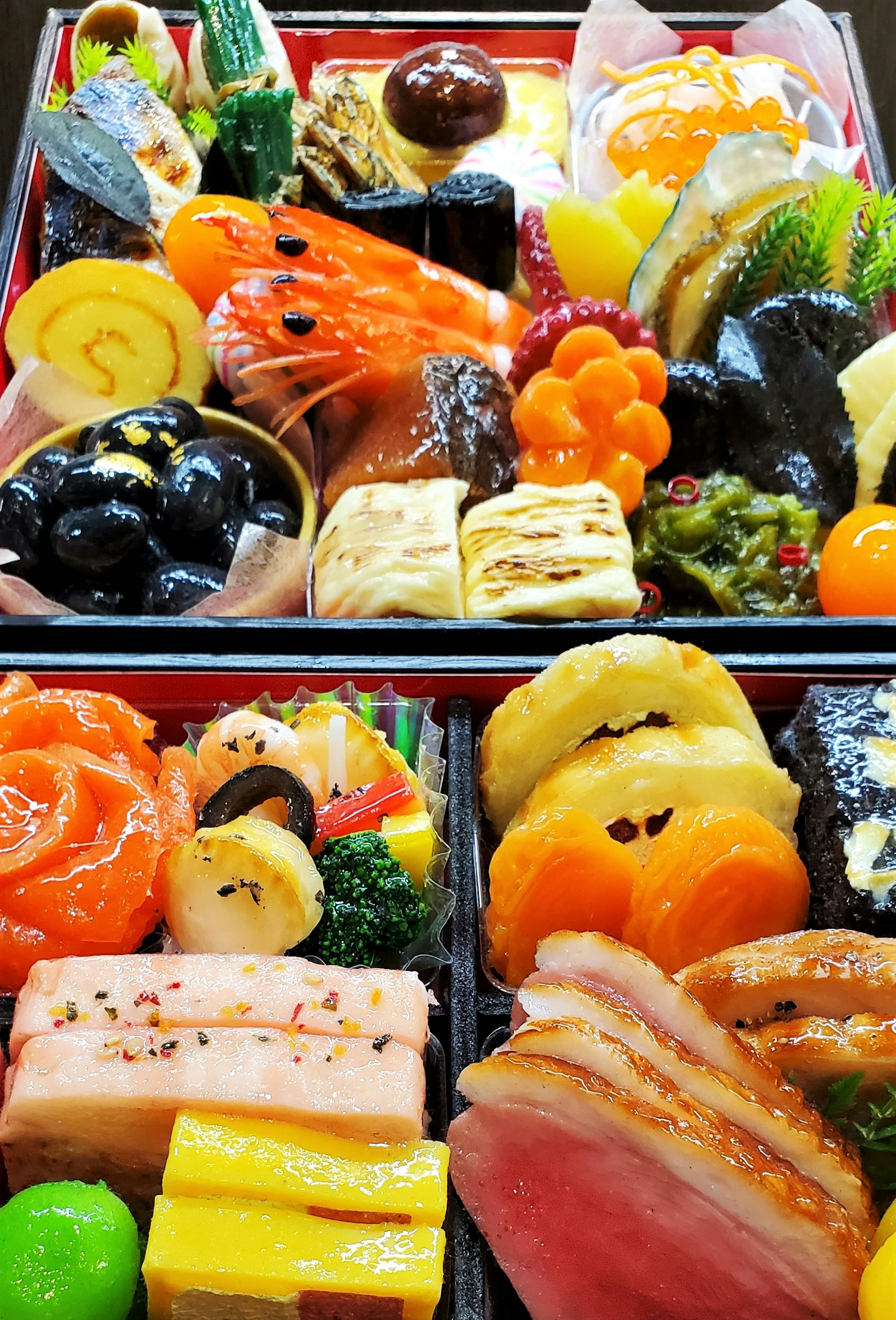 A beautifully arranged selection of colorful Japanese osechi cuisine