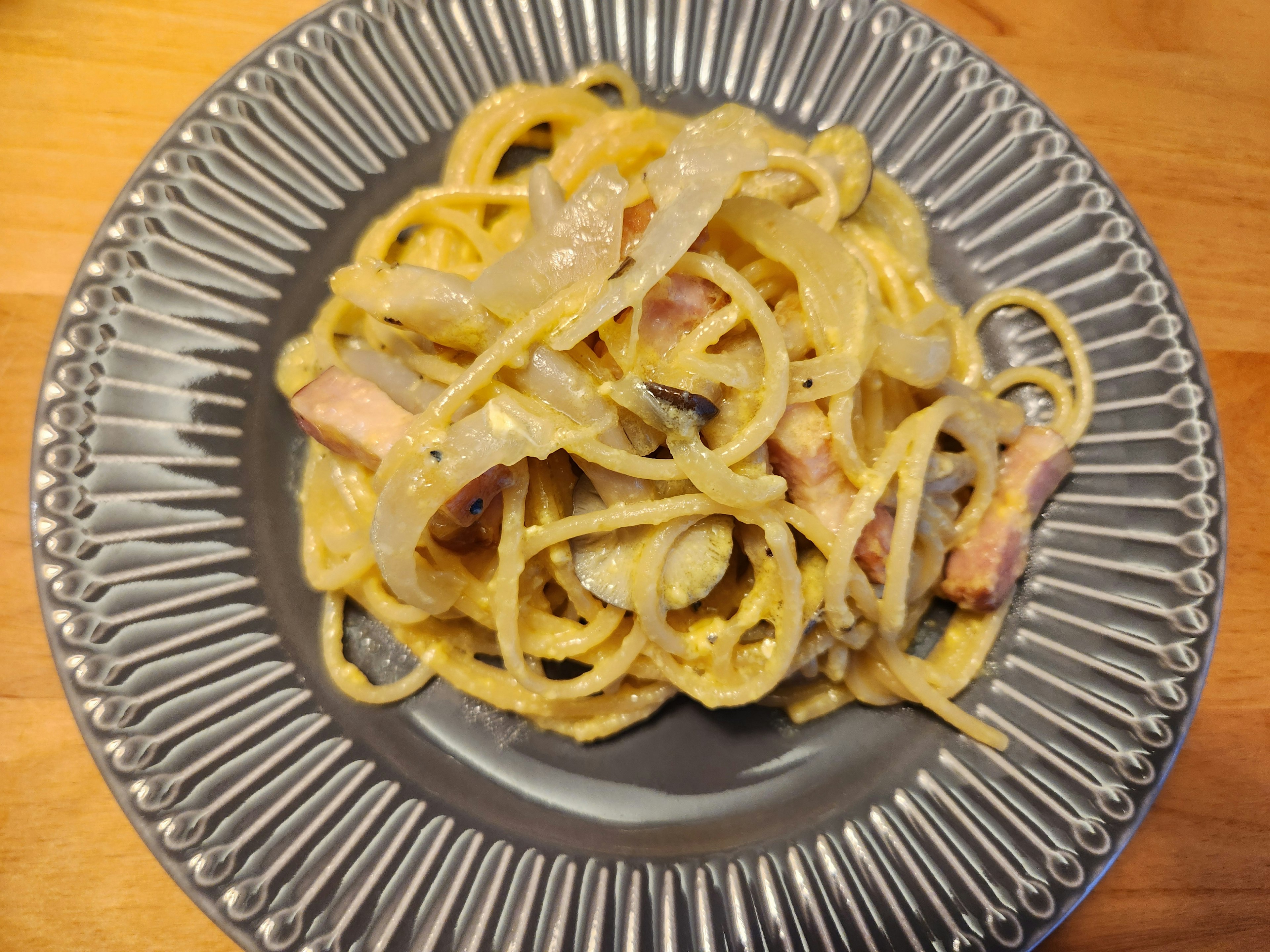 Creamy pasta dish served on a silver plate