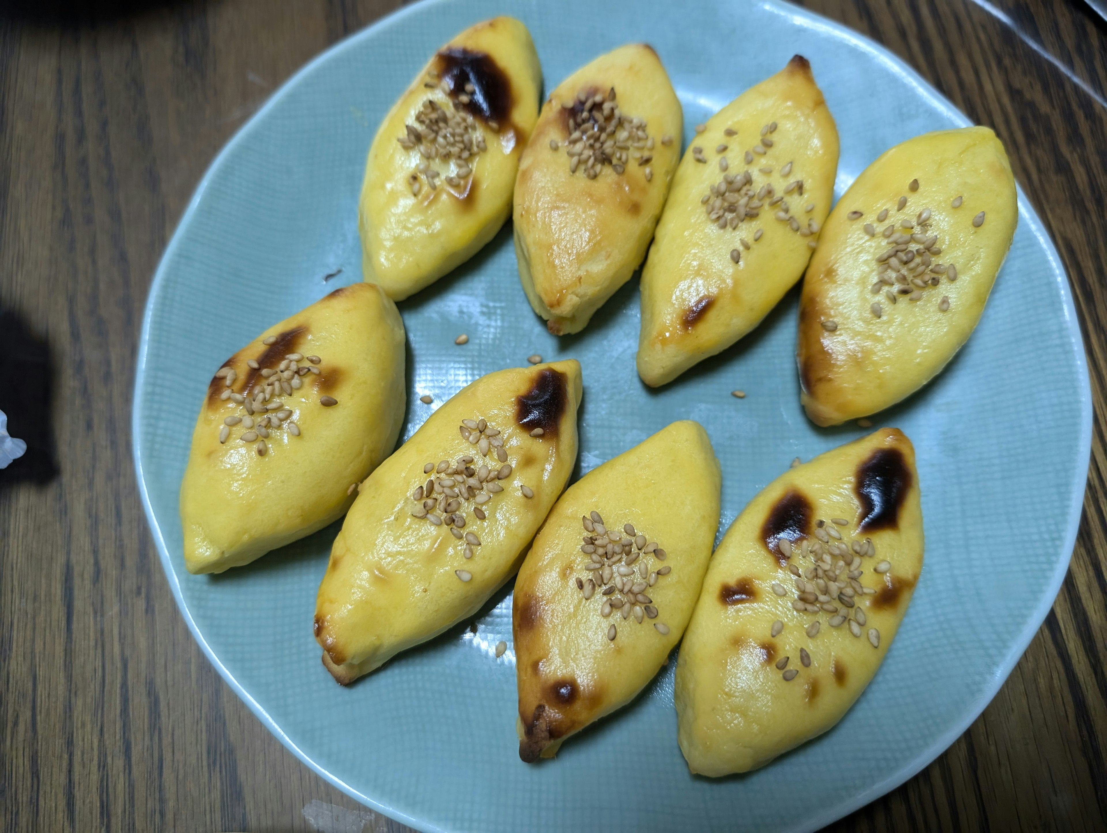 Golden baked pastries arranged on a blue plate