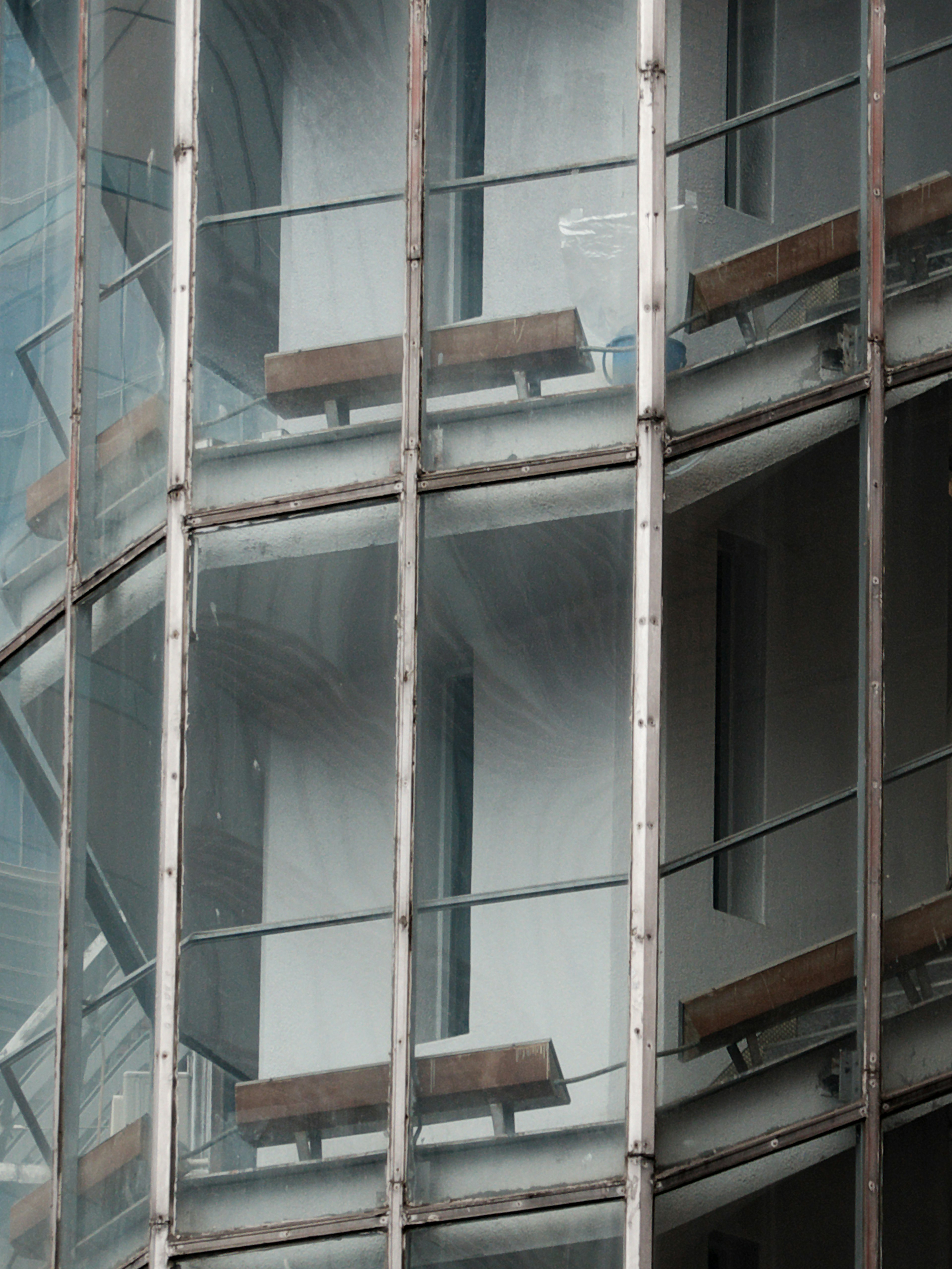 Close-up of balconies on a modern building with glass facade