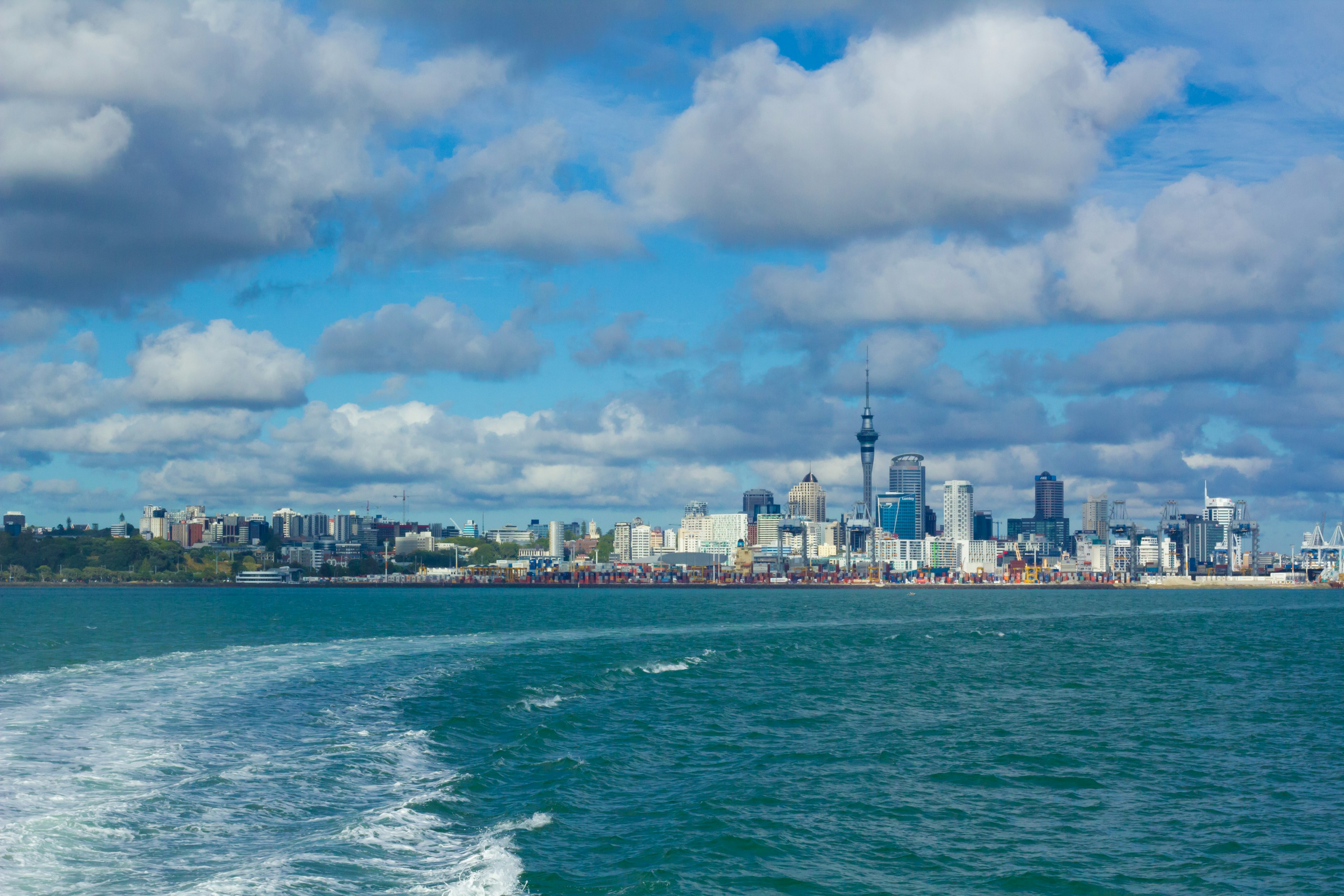 City skyline with water and clouds in the background