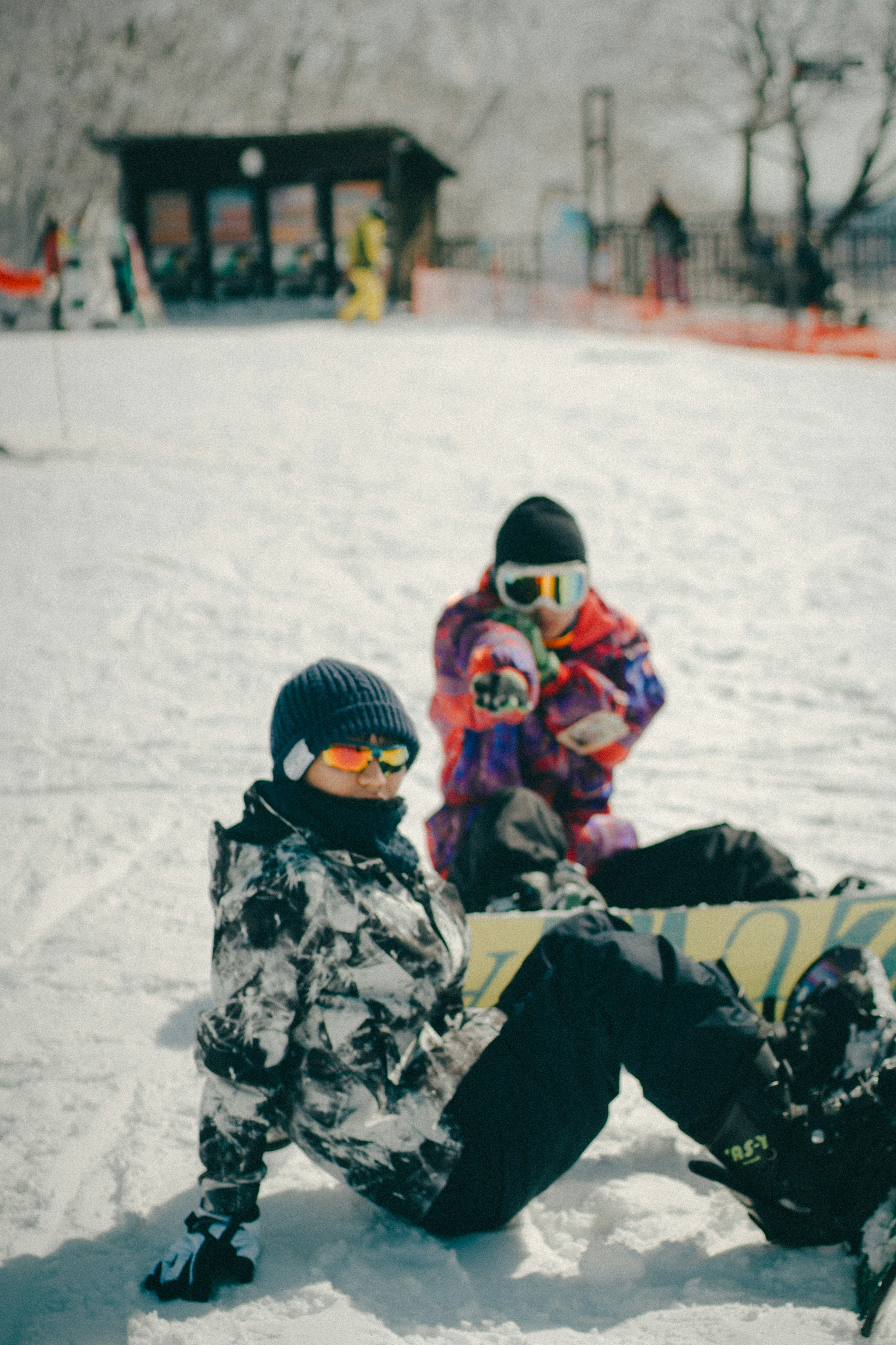 Children playing in the snow wearing ski gear