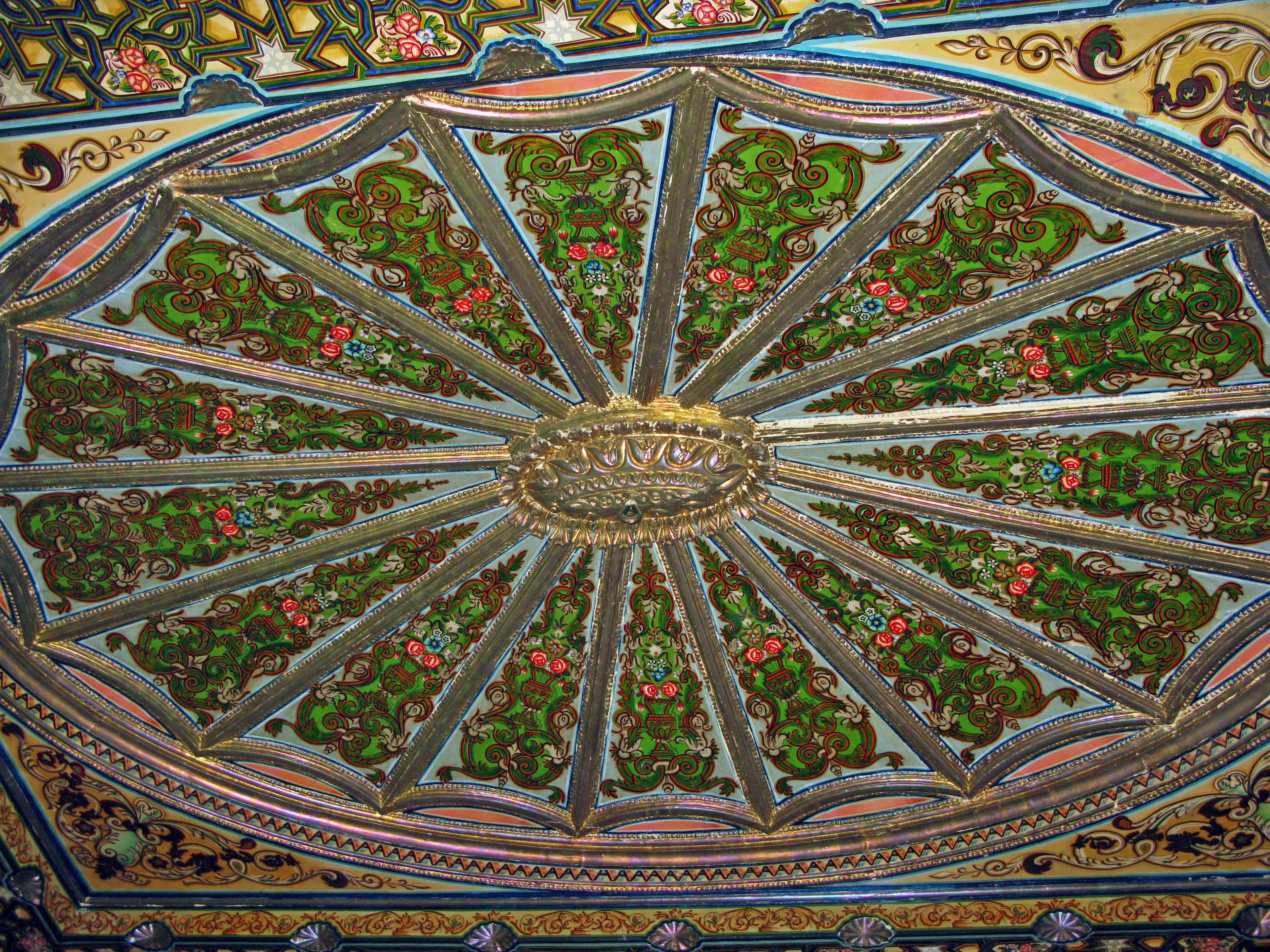 Ornate ceiling design featuring colorful floral patterns and intricate details