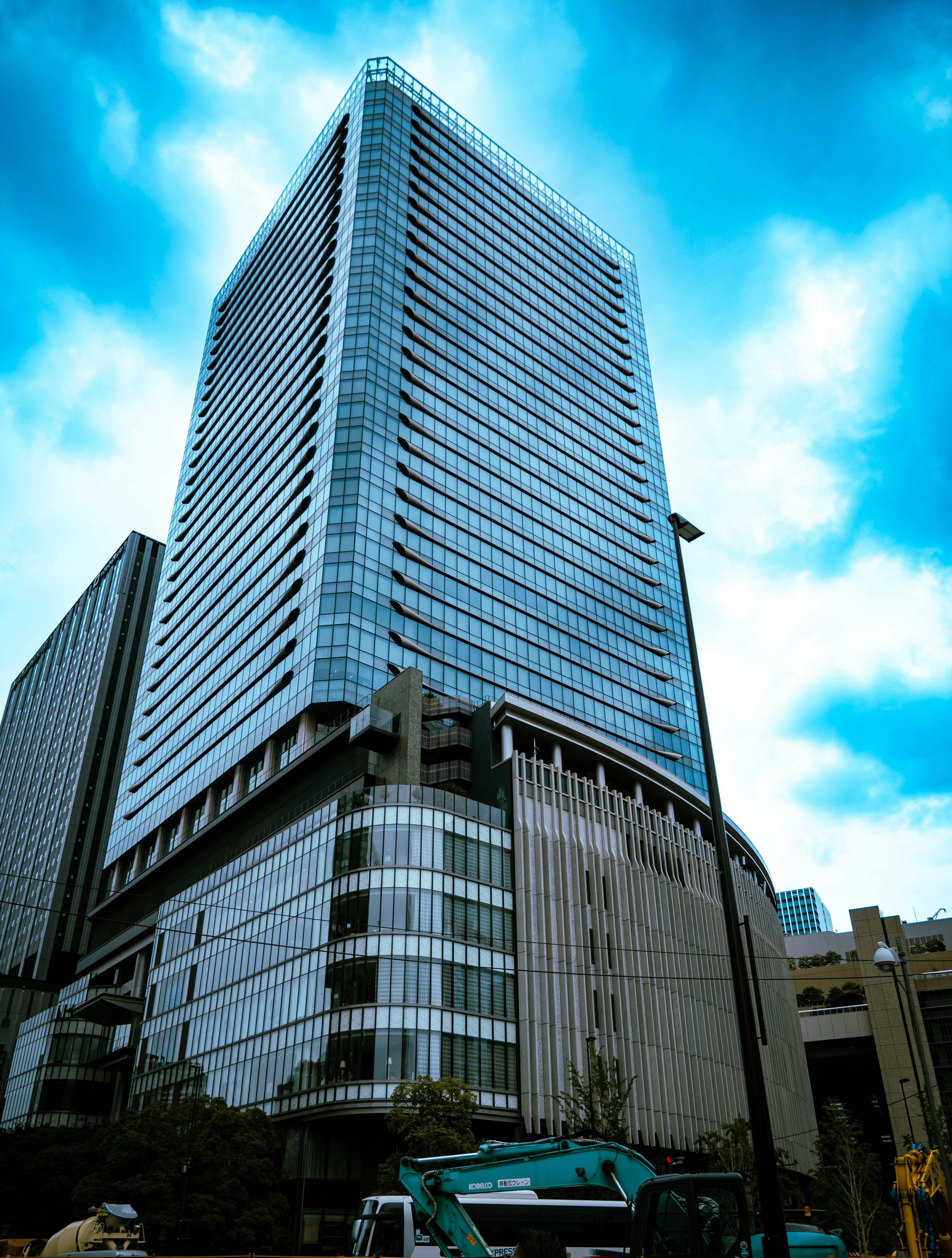 Modern skyscraper exterior with blue sky