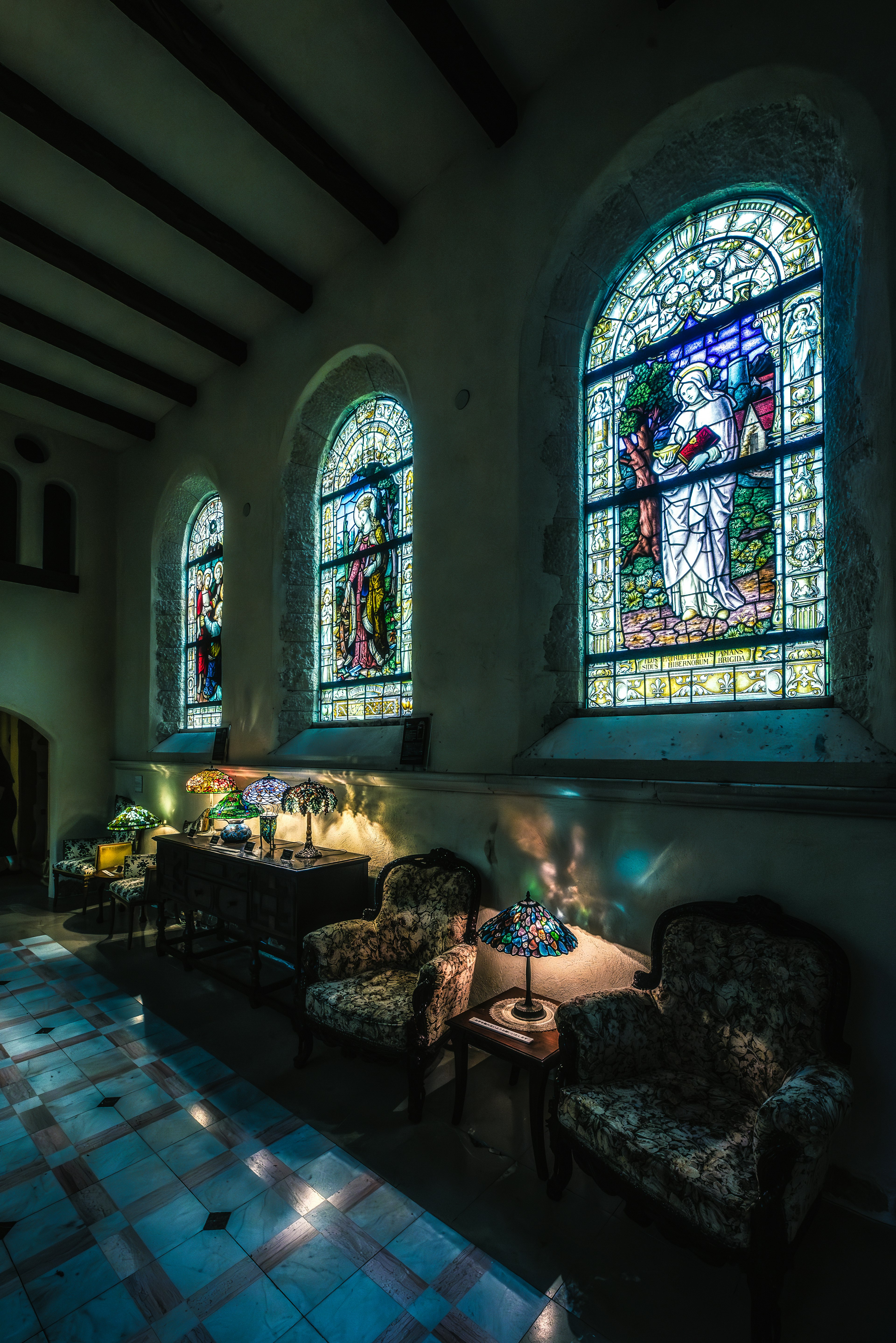 Interior of a quiet room featuring beautiful stained glass windows