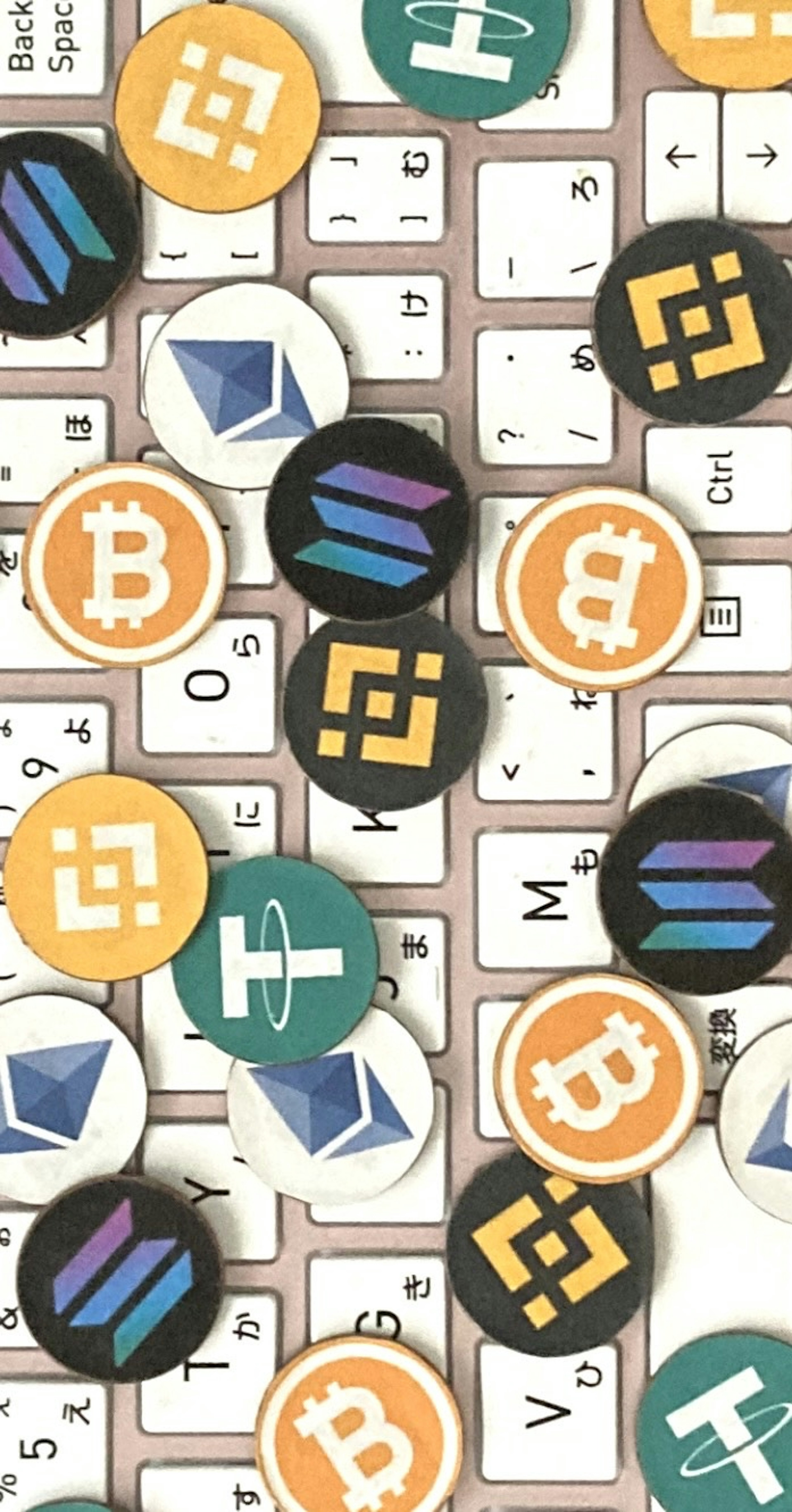 Cryptocurrency coins scattered on a keyboard