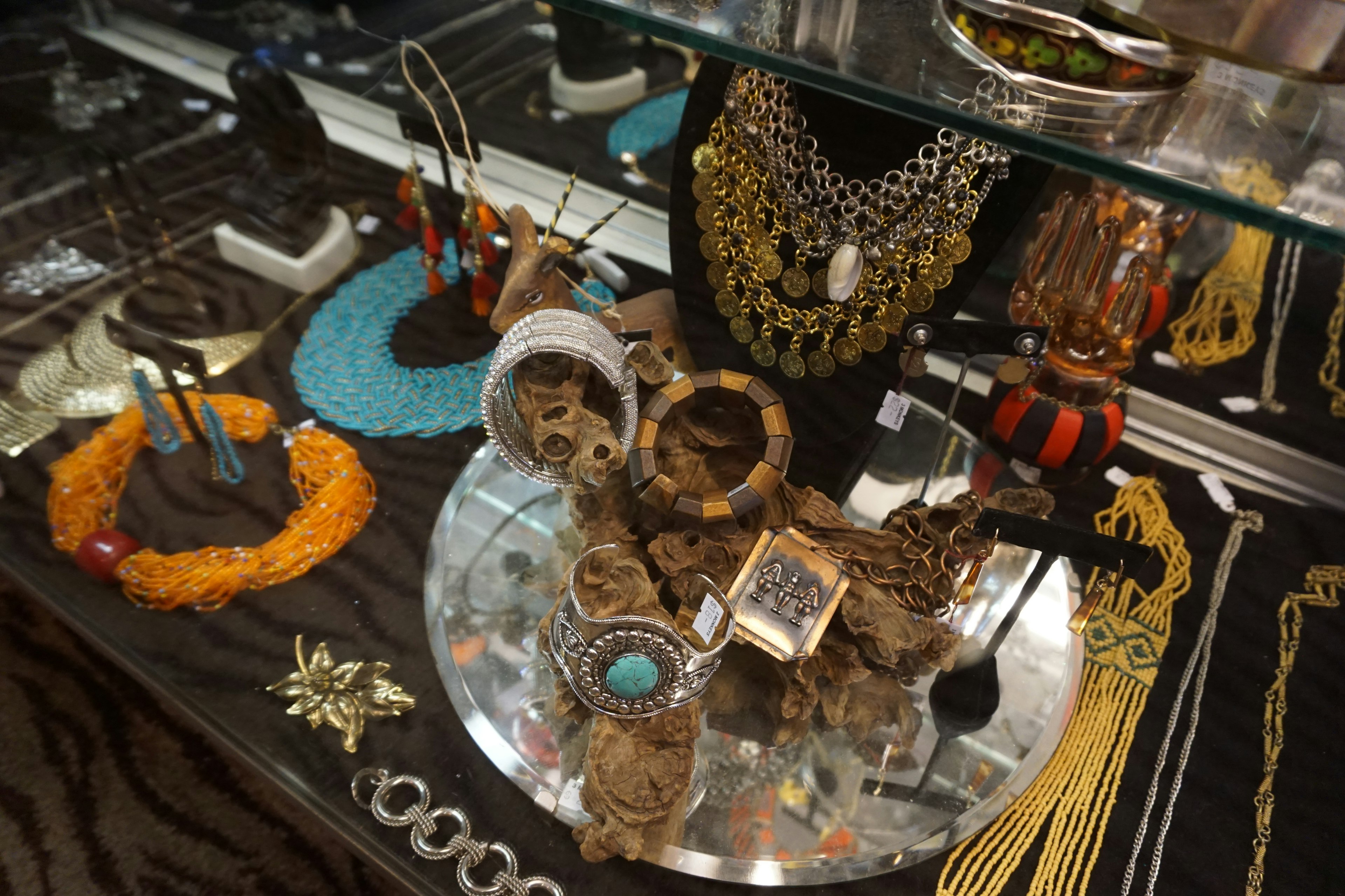 Display of various jewelry including necklaces bracelets and earrings