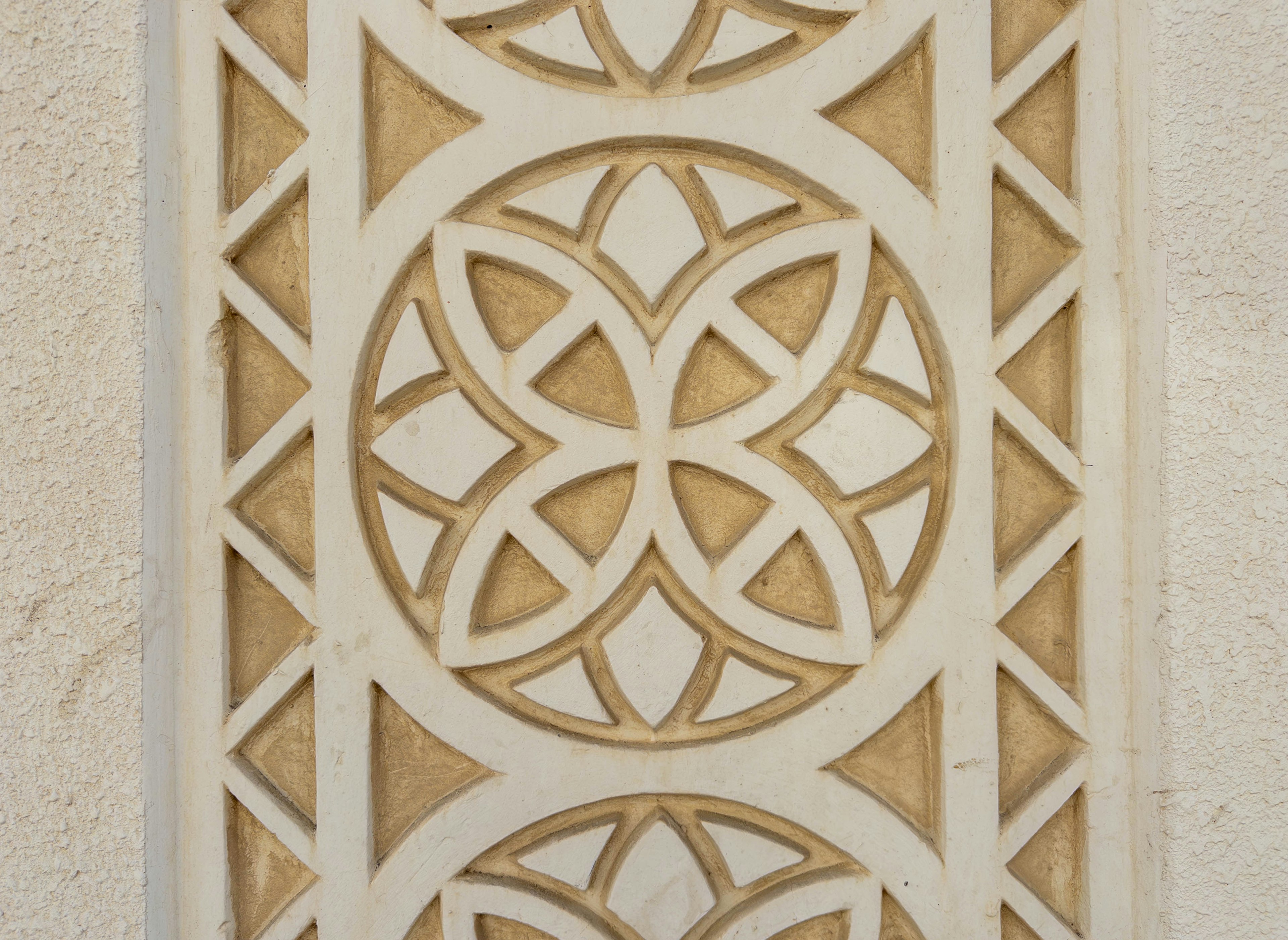 Decorative patterned section of a white wall