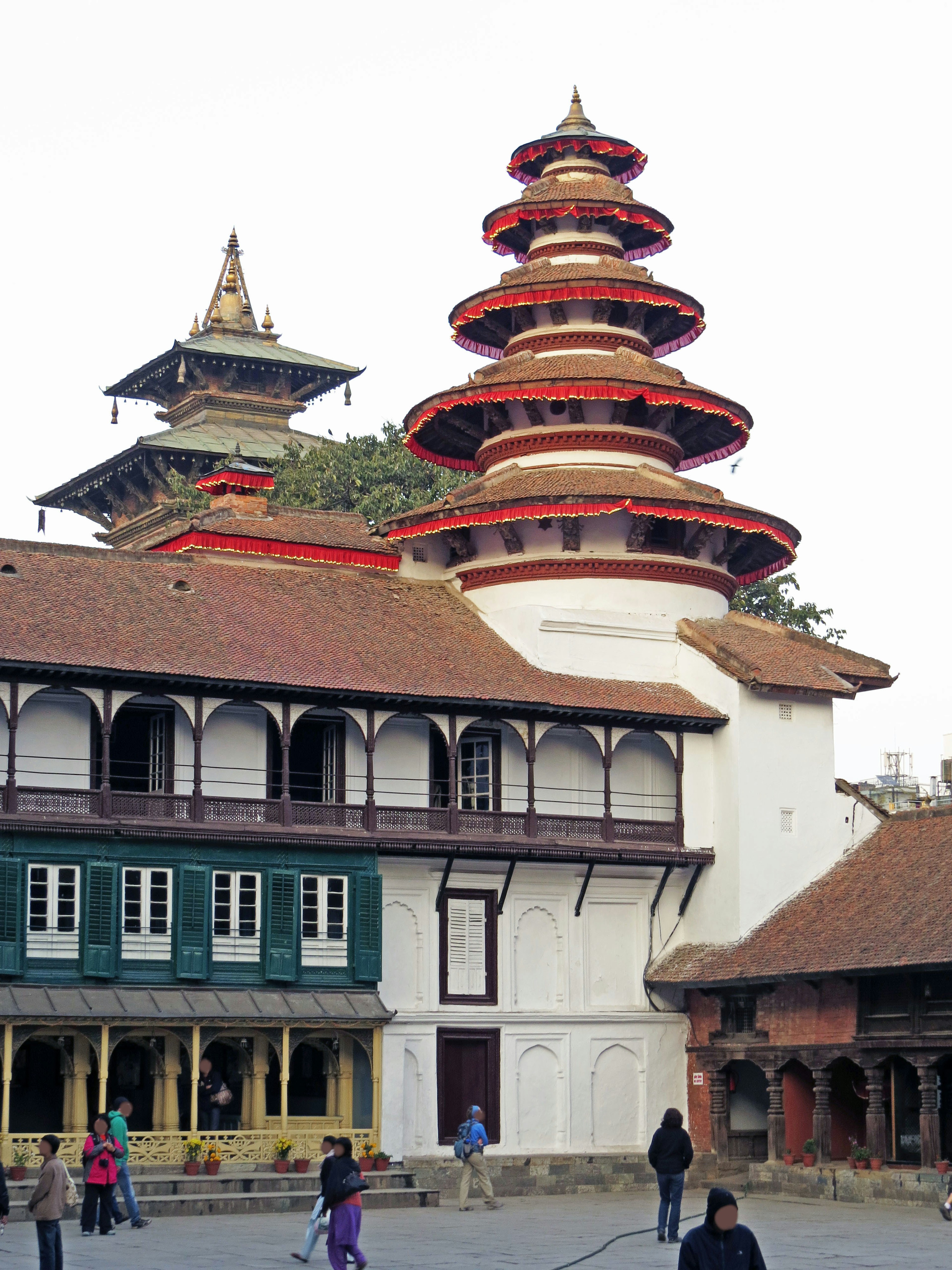 Traditional Nepalese temple architecture with surrounding buildings