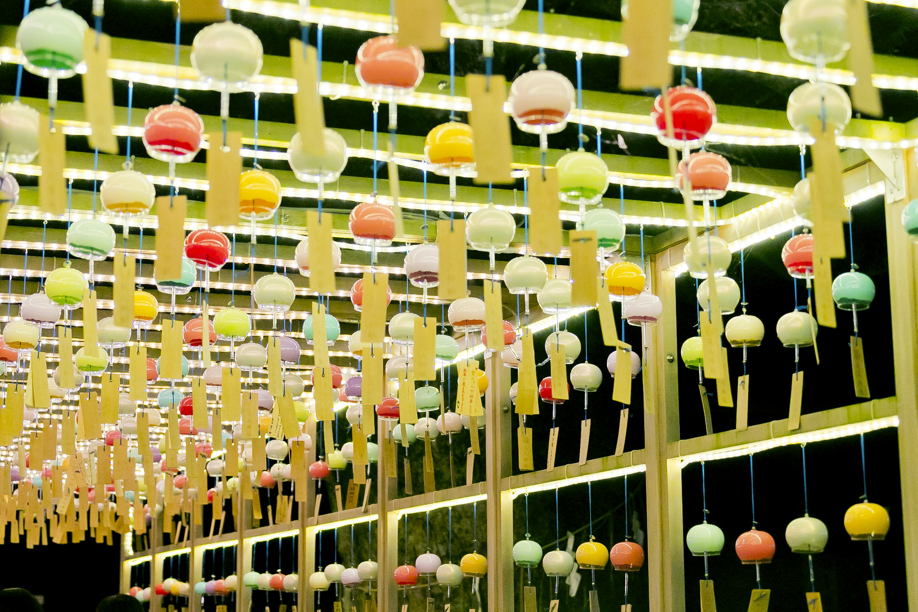 Colorful wind chimes hanging in an indoor decoration