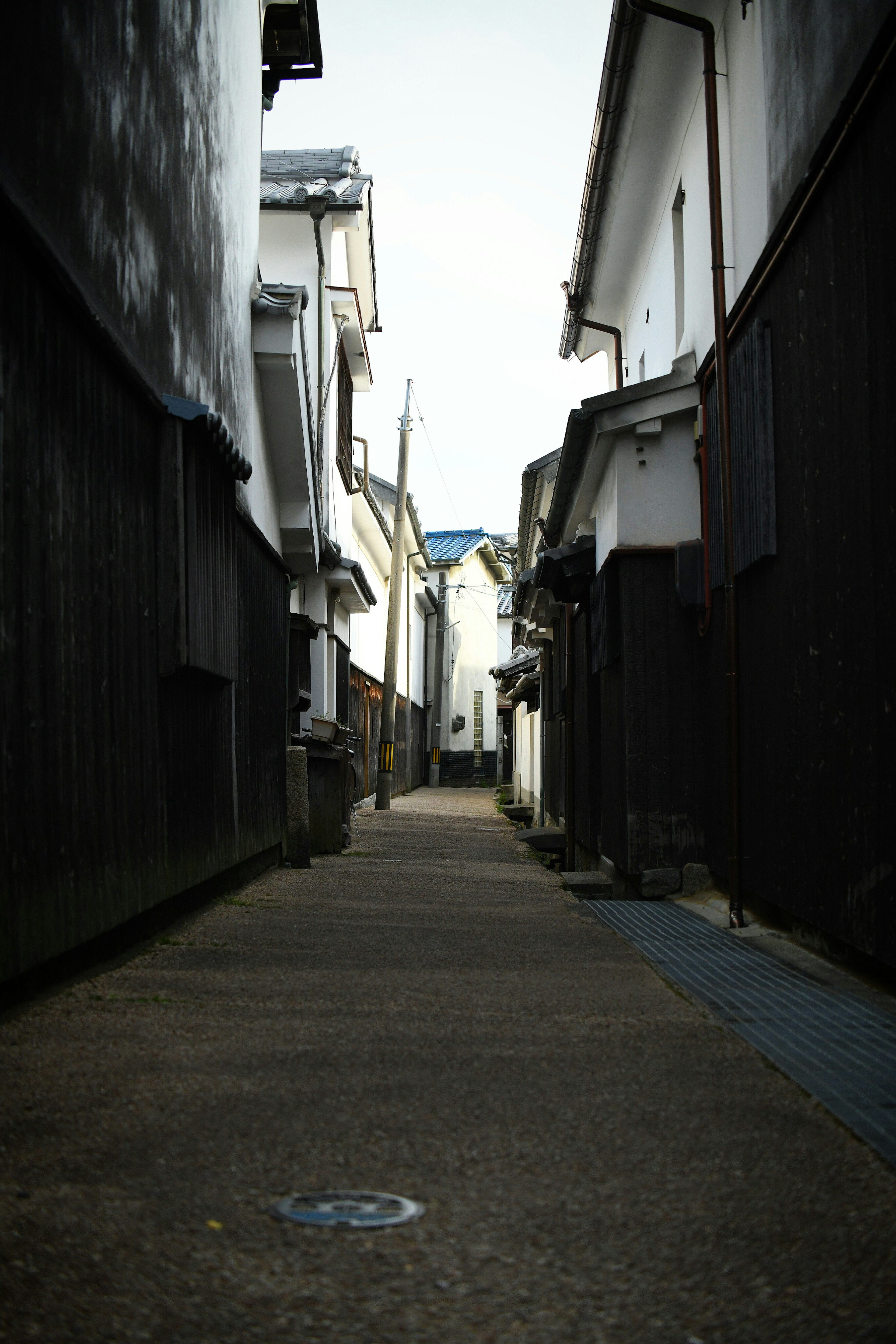 Narrow alleyway leading through a quiet town