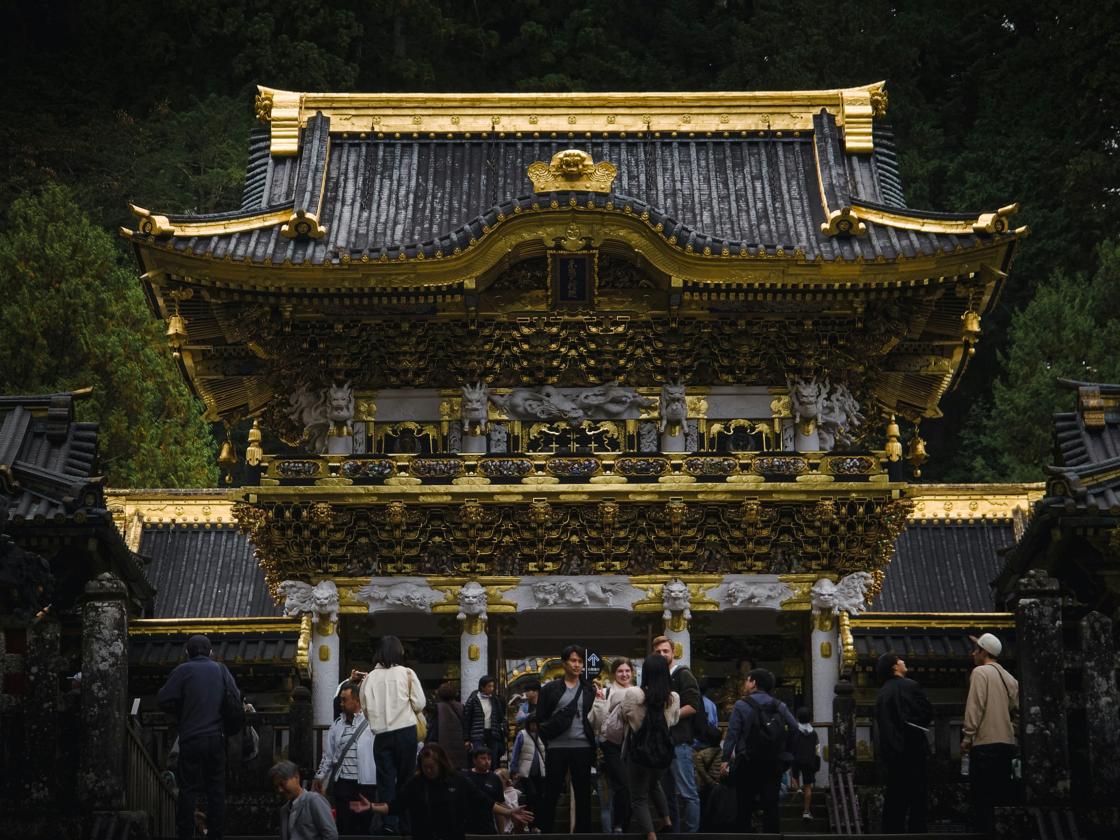 Nikko Toshogu Shrine with golden architecture and visitors