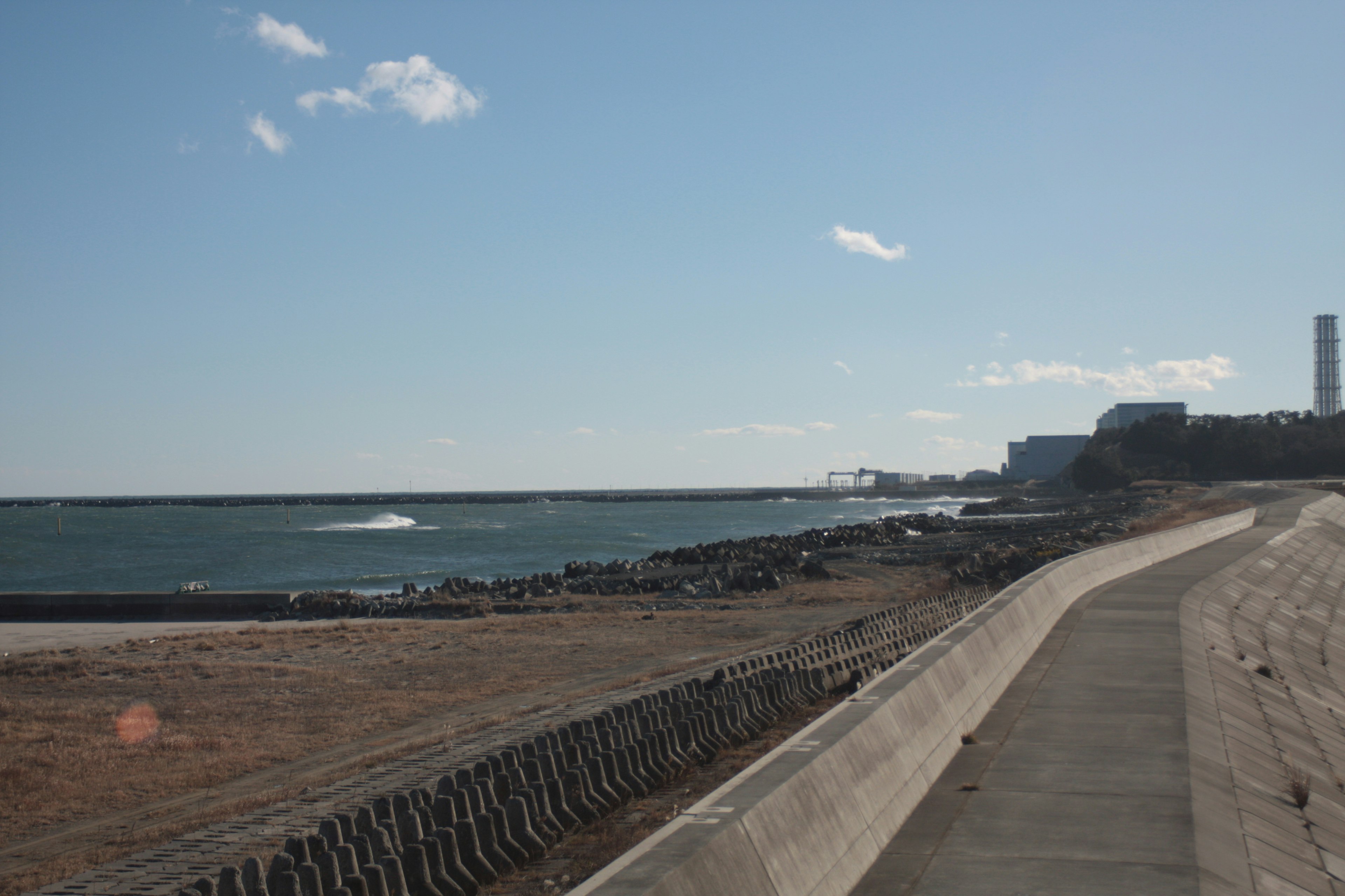 Coastal path with waves and clear sky