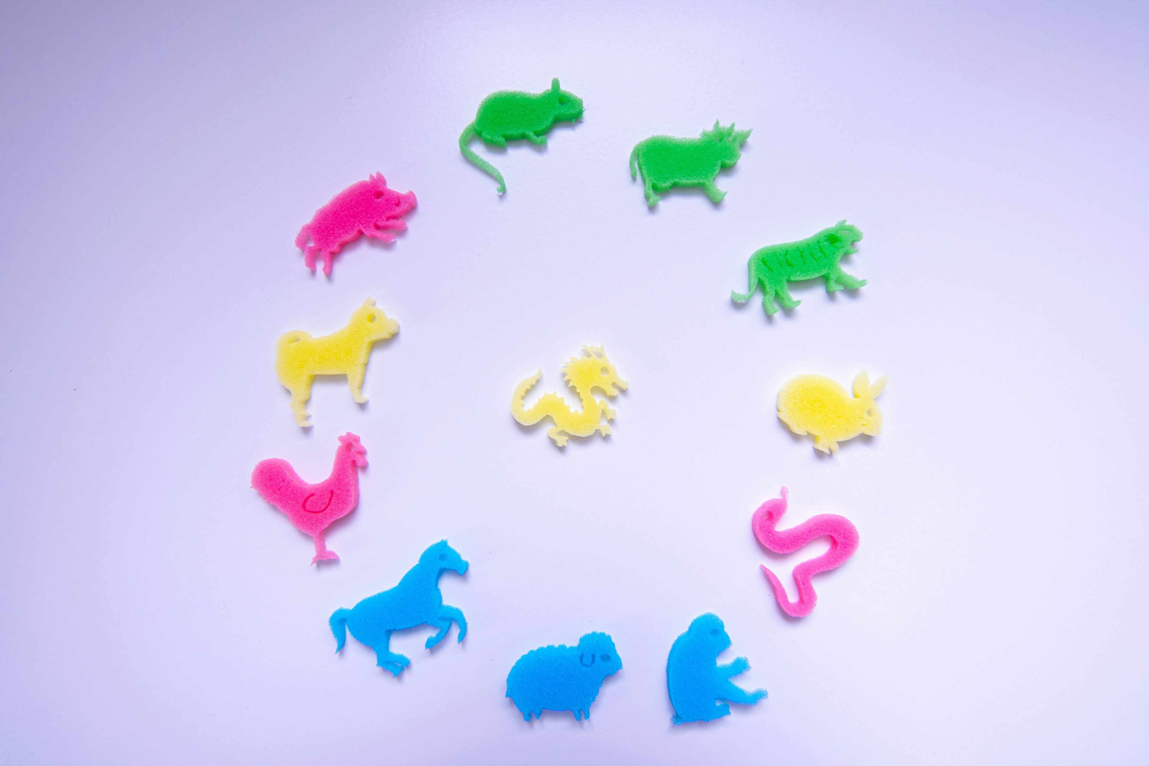 Colorful animal shapes arranged in a circular pattern