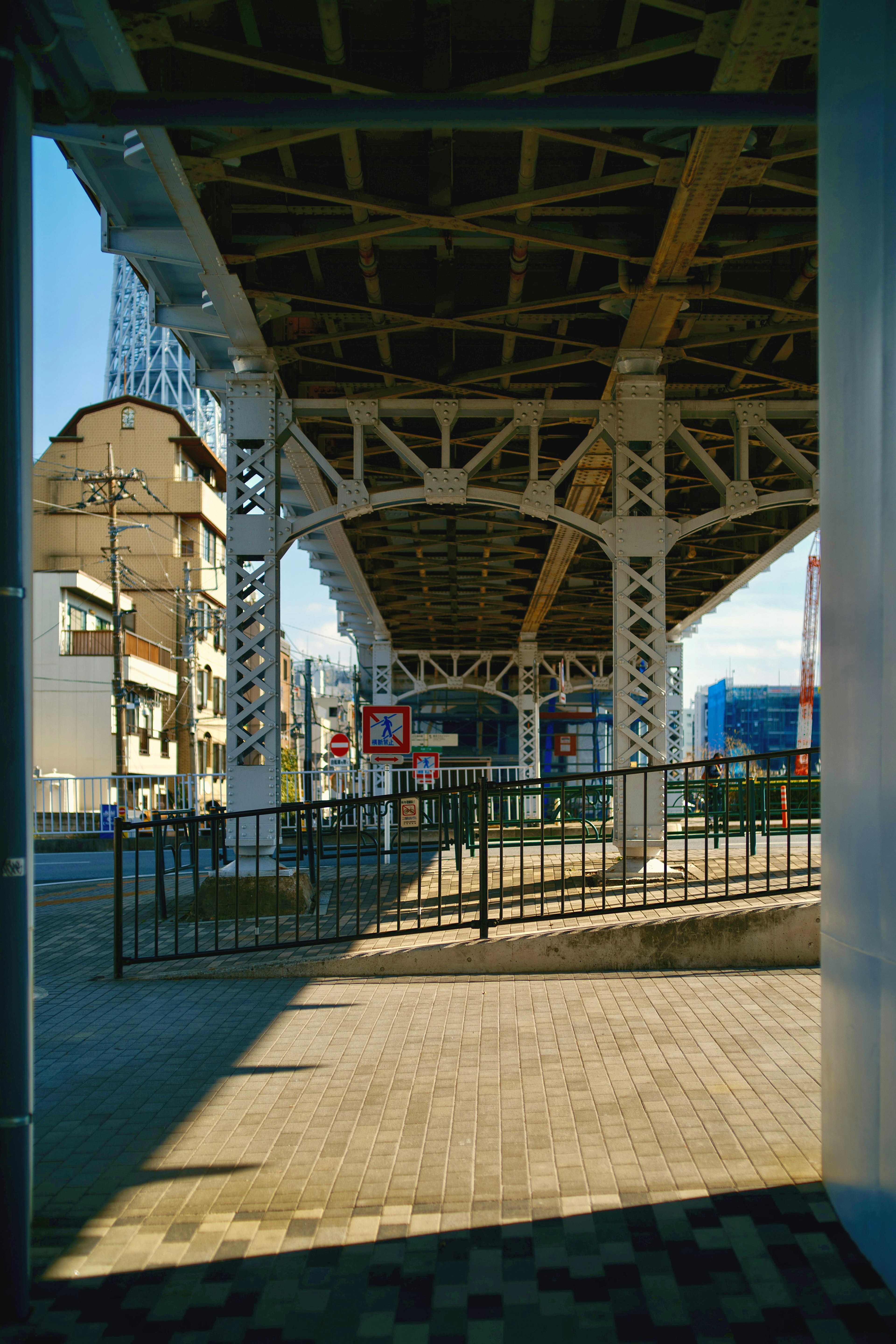 Contrast of the structure and shadows under a railway viaduct