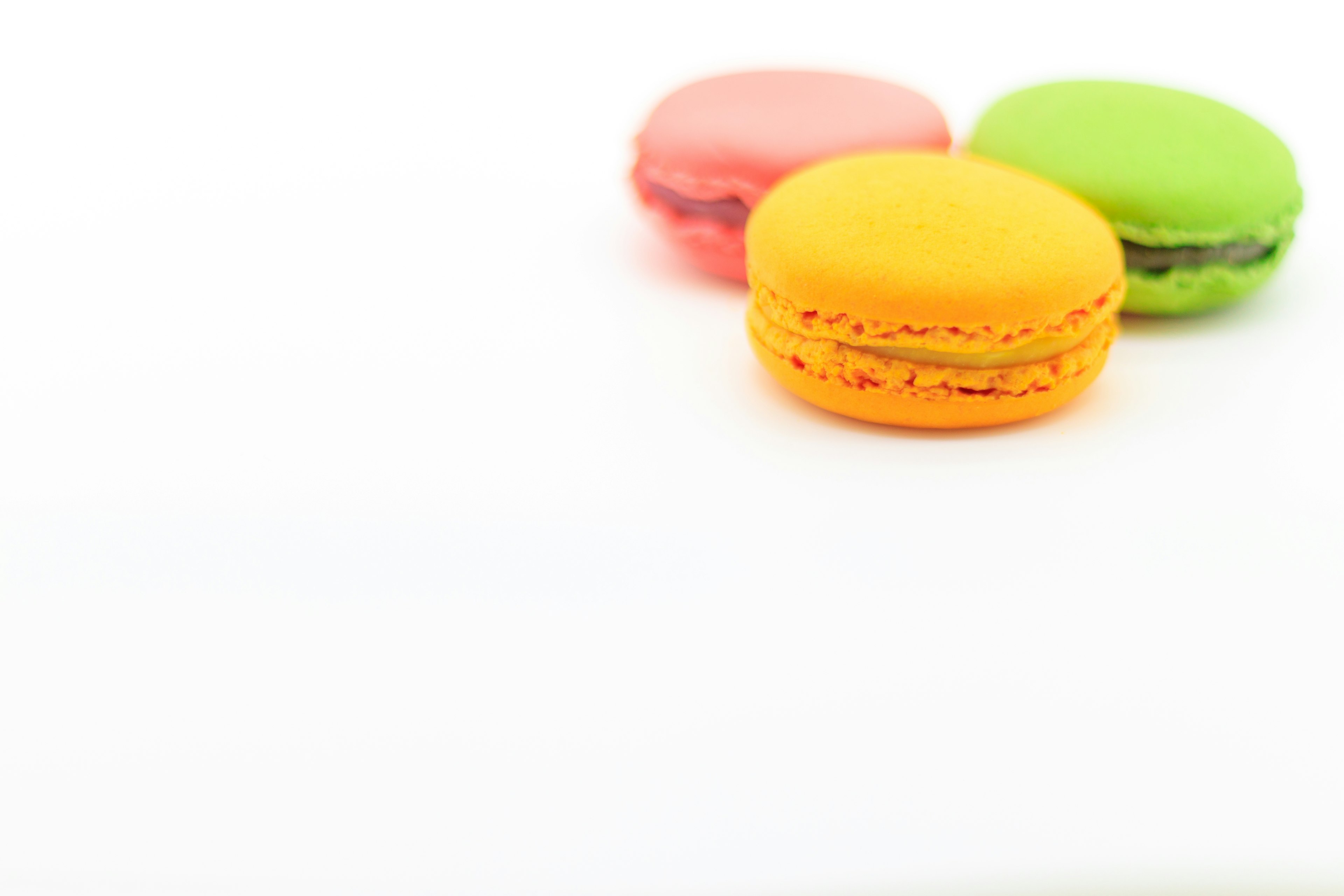 Colorful macarons on a white background