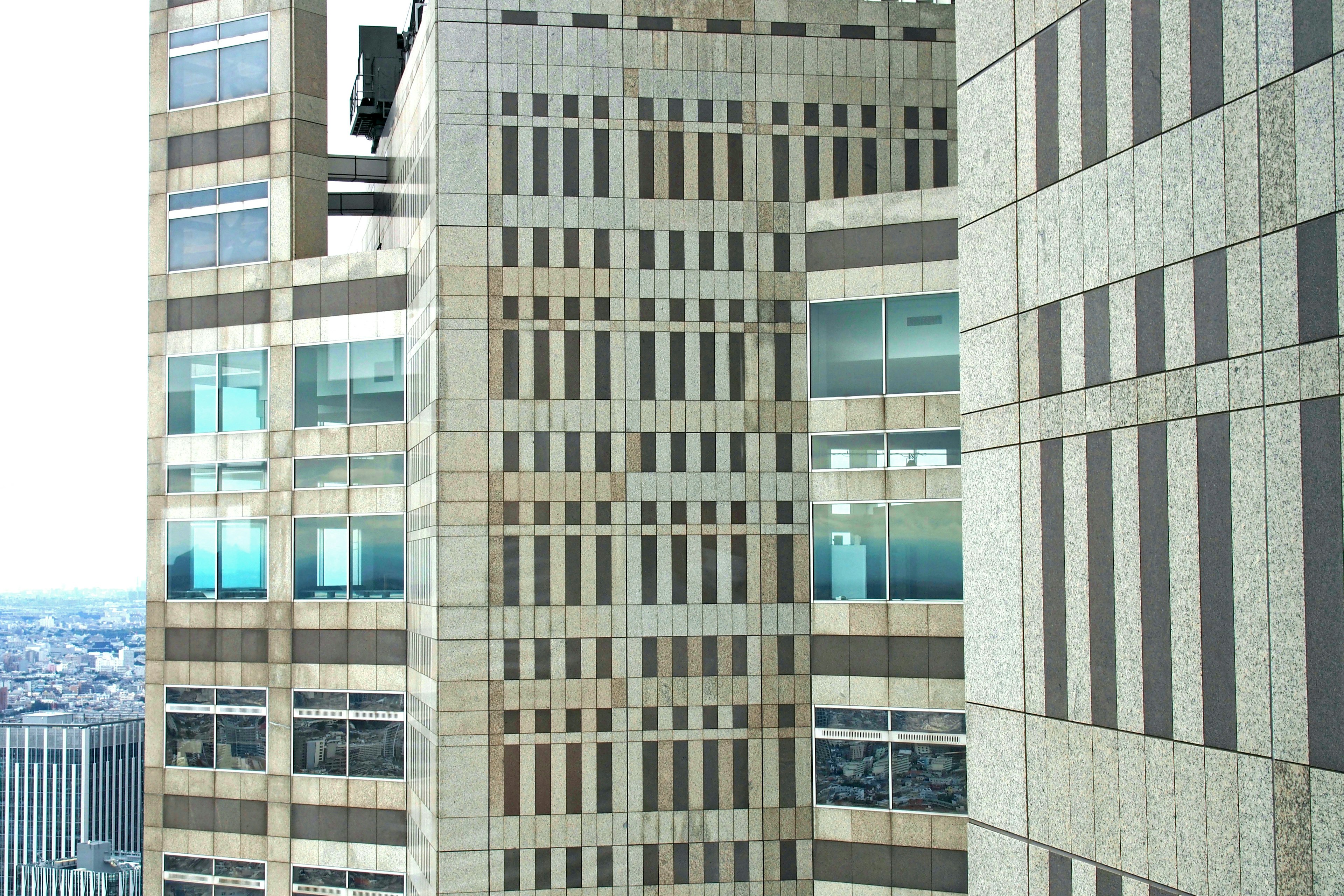 Exterior view of a skyscraper featuring windows and striped design