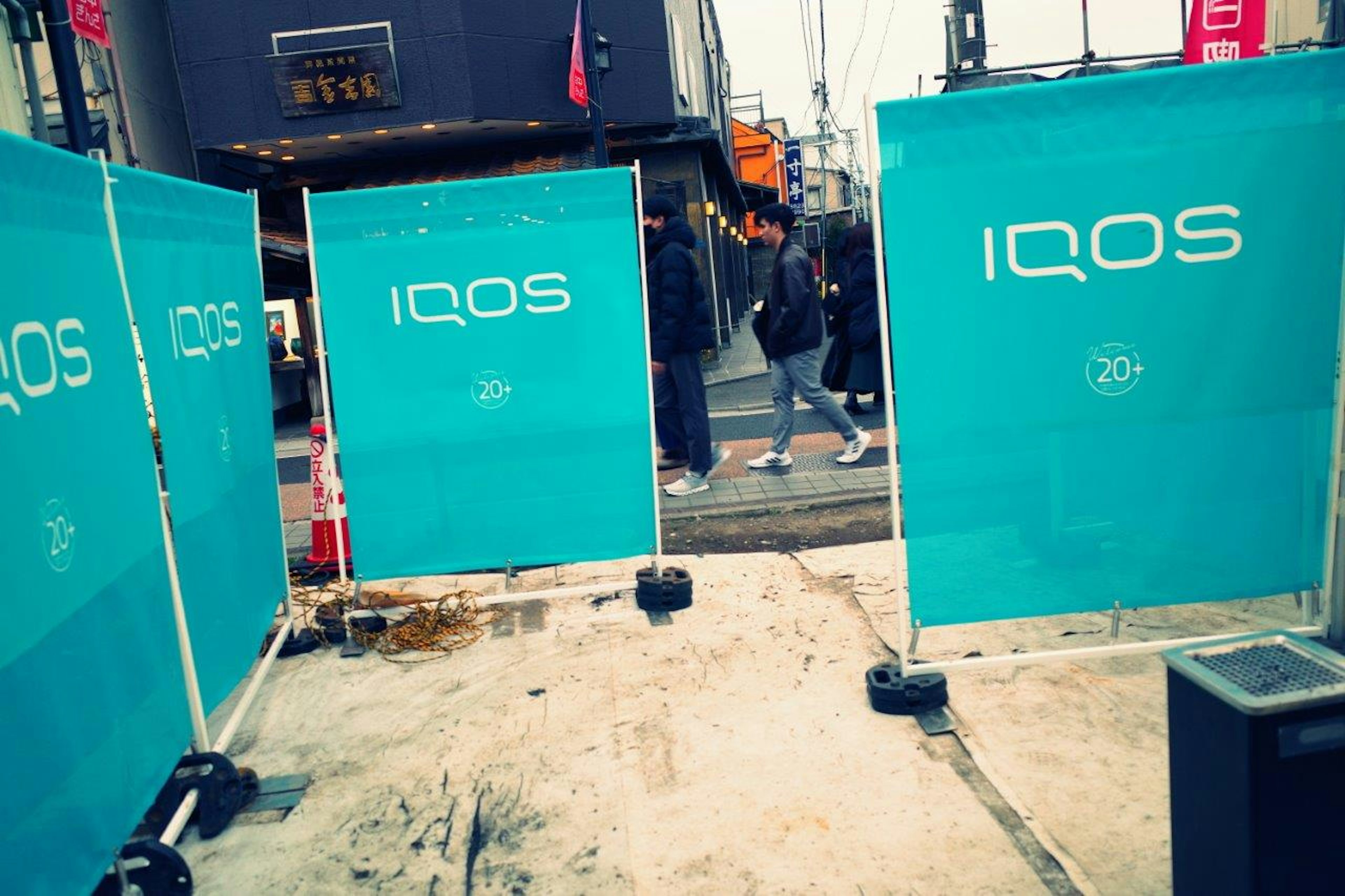 Blue IQOS banners set up on the street