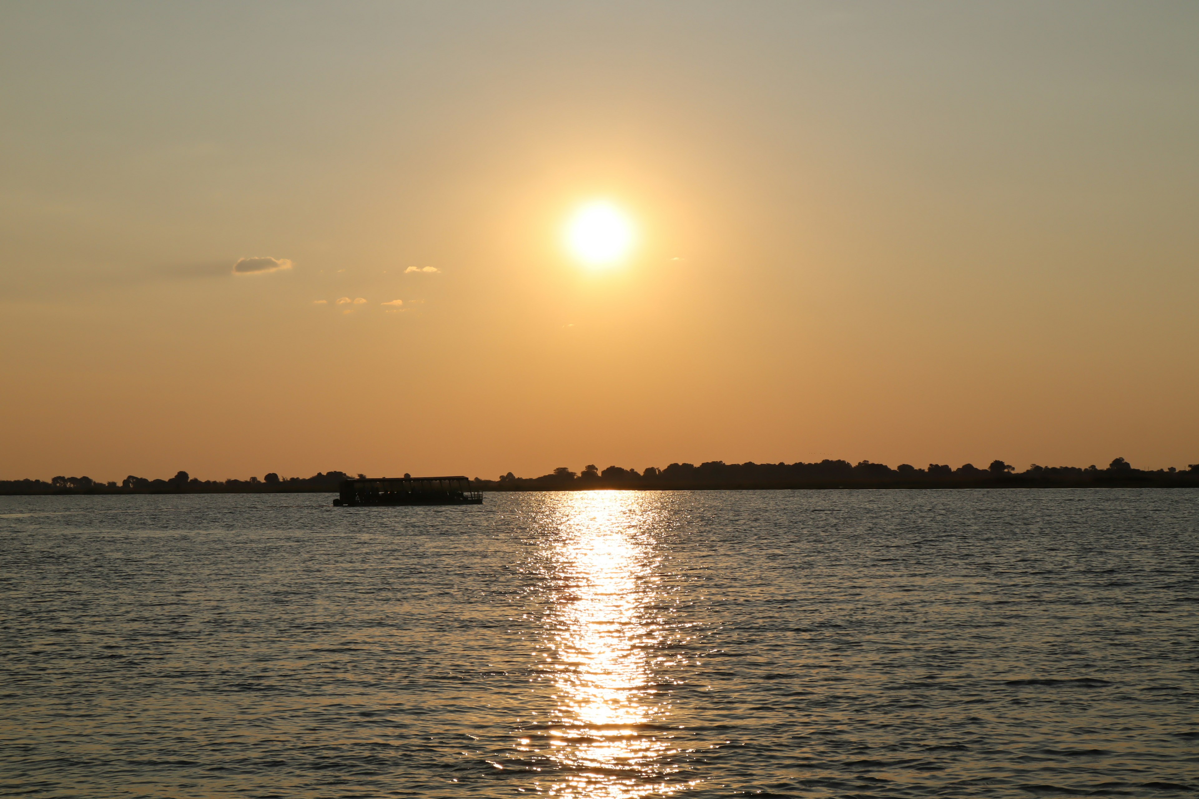 Sunset over the river with reflections on the water