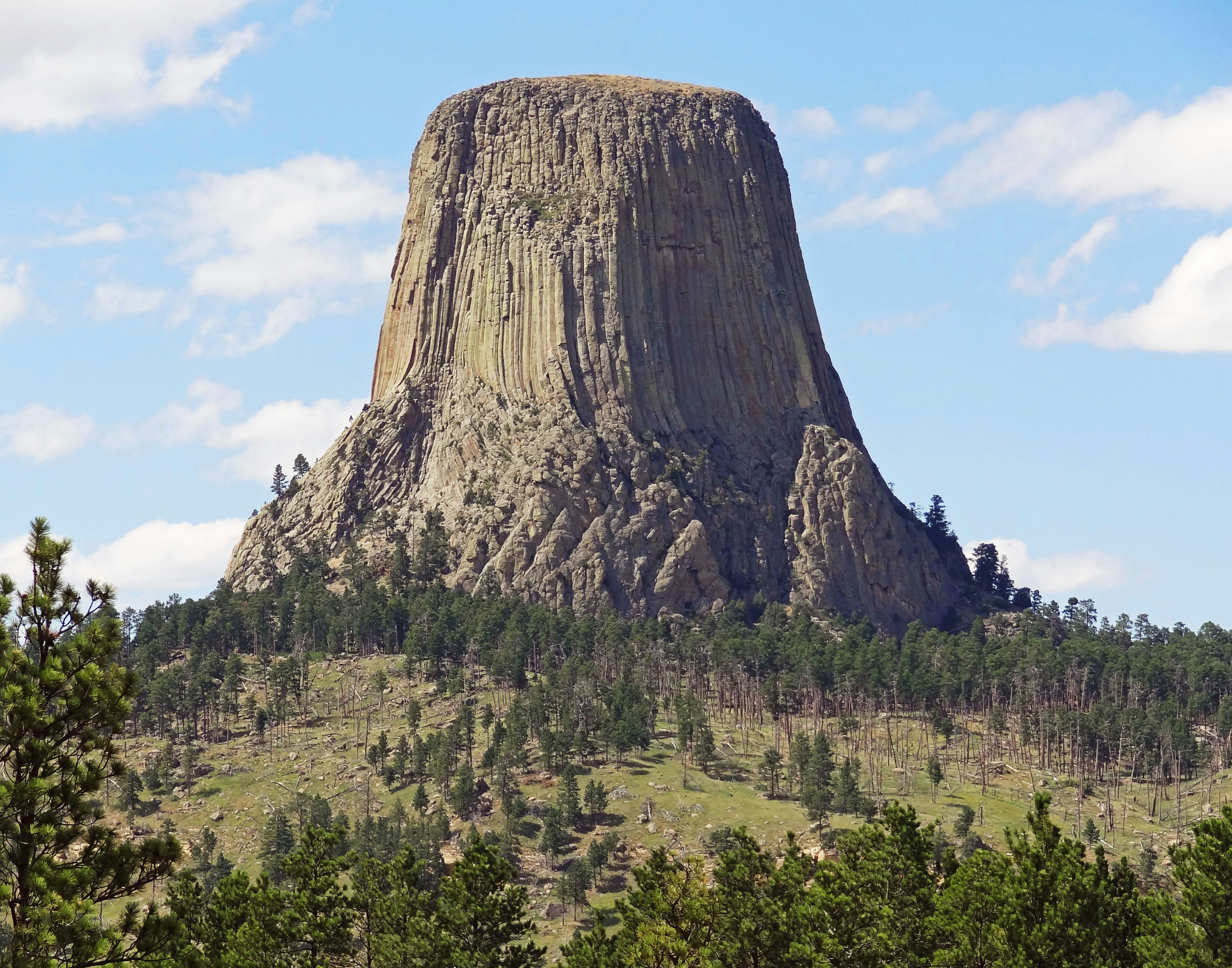 A unique flat-topped rock formation under a blue sky