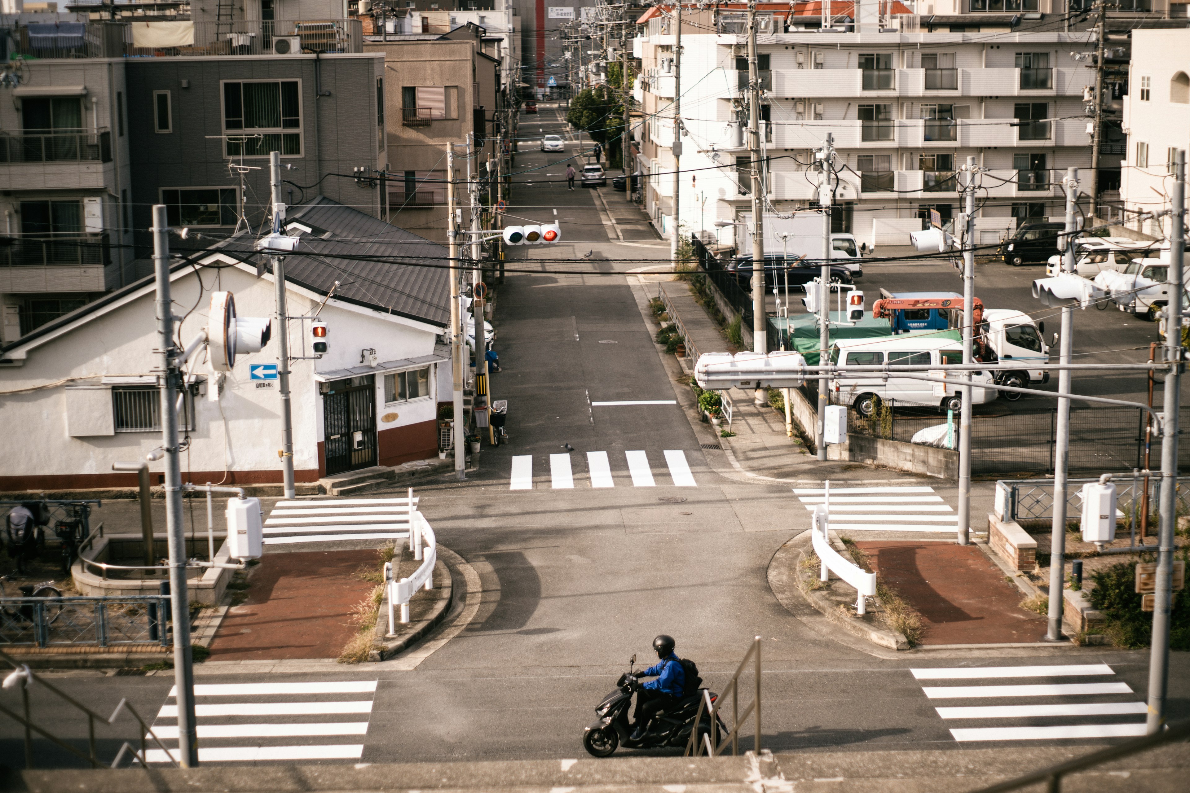 City intersection view with a person in a wheelchair