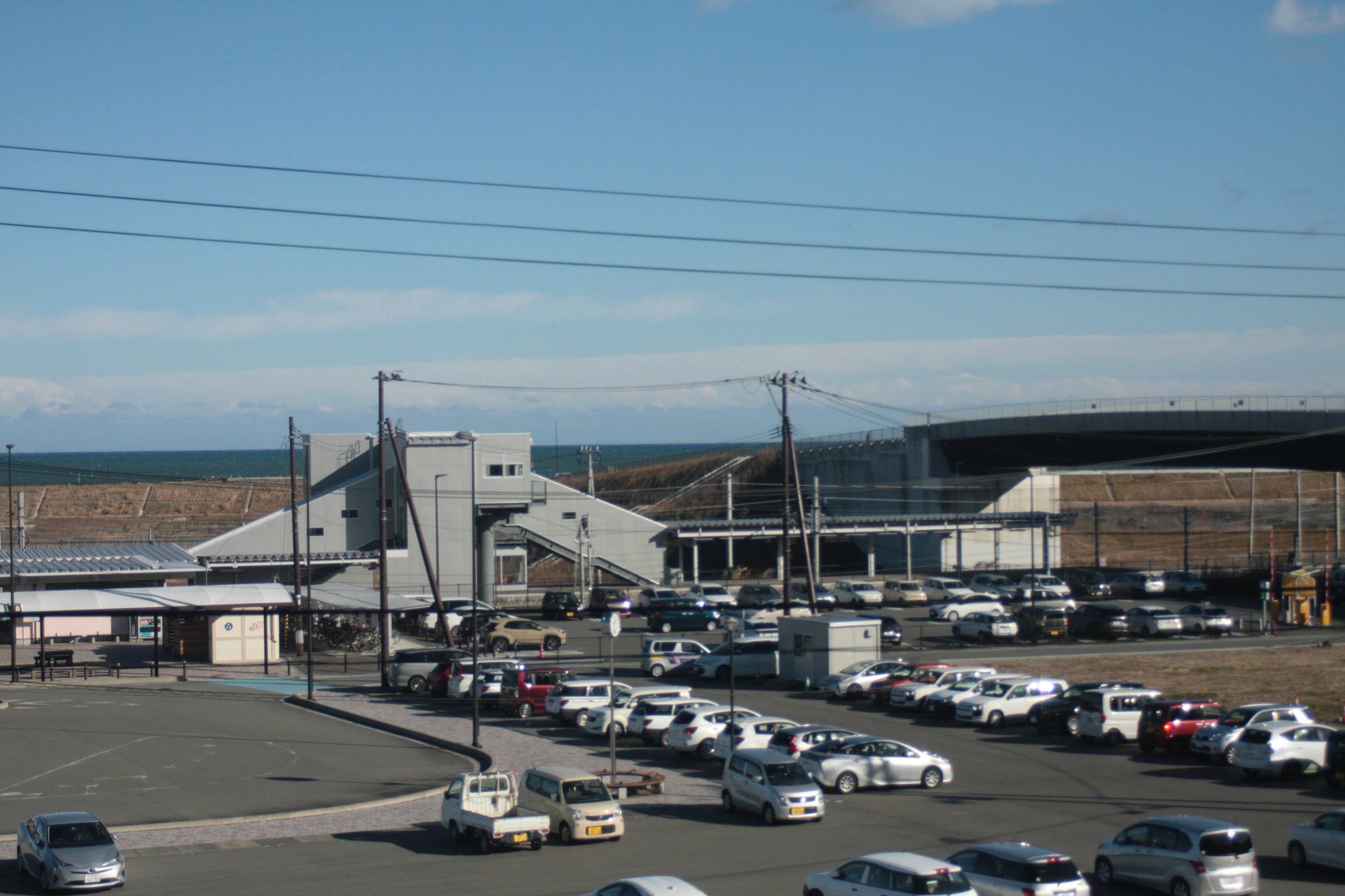 Industrial building near the sea with a parking lot