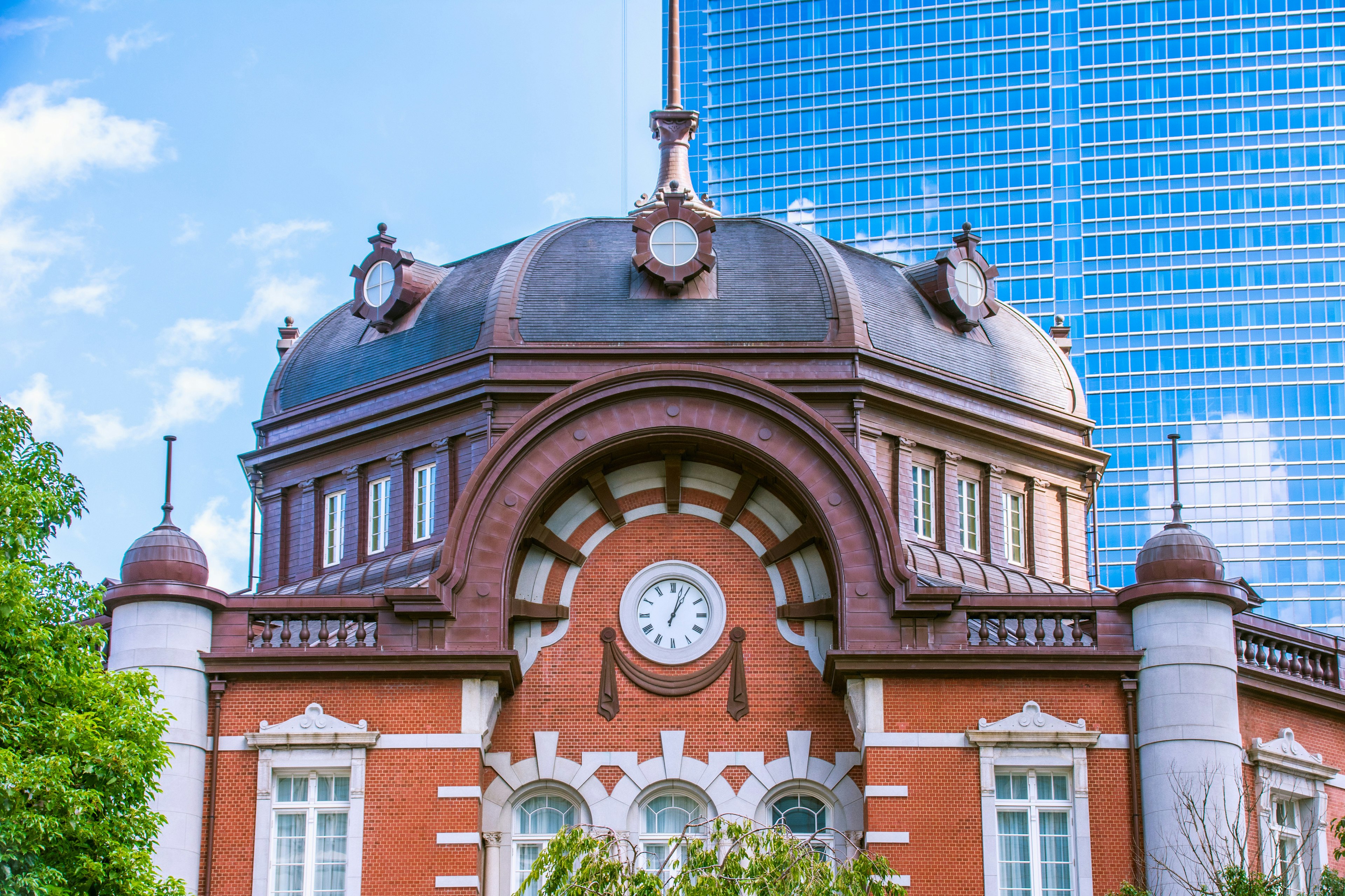 The beautiful dome and red brick facade of Tokyo Station