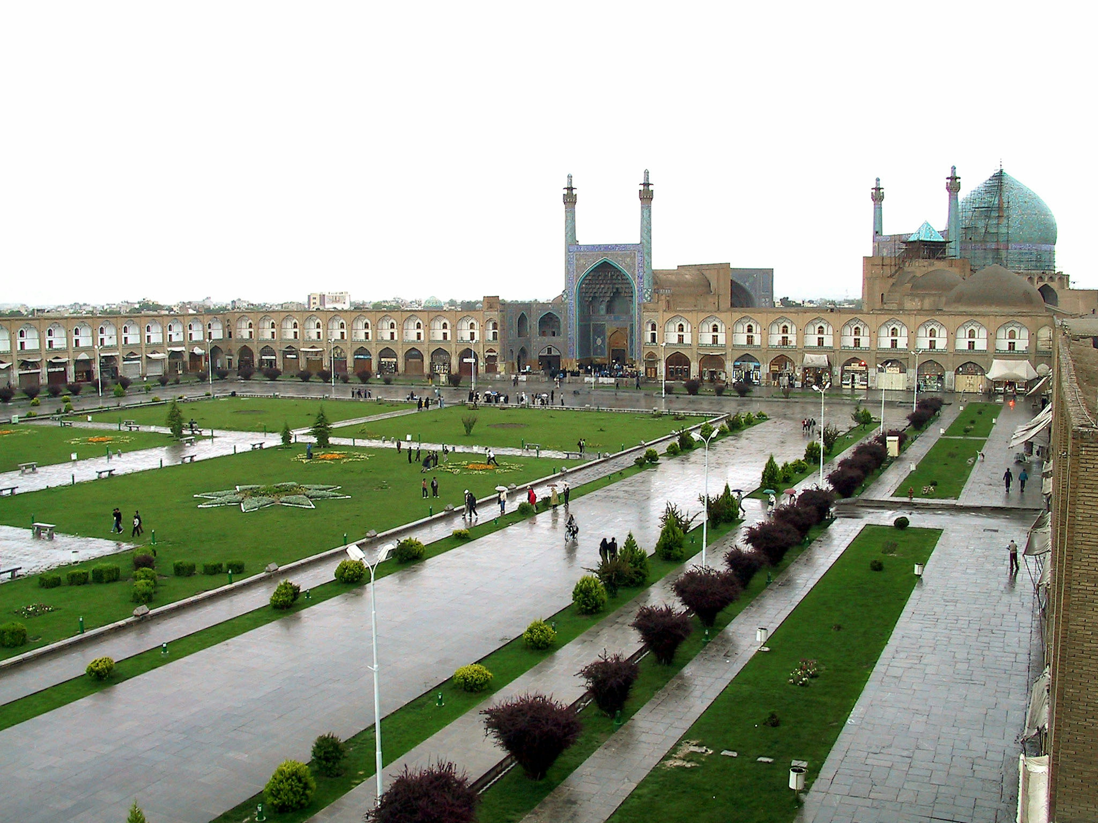 Beautiful view of Naghsh-e Jahan Square in Isfahan Iran featuring green lawns and historic buildings