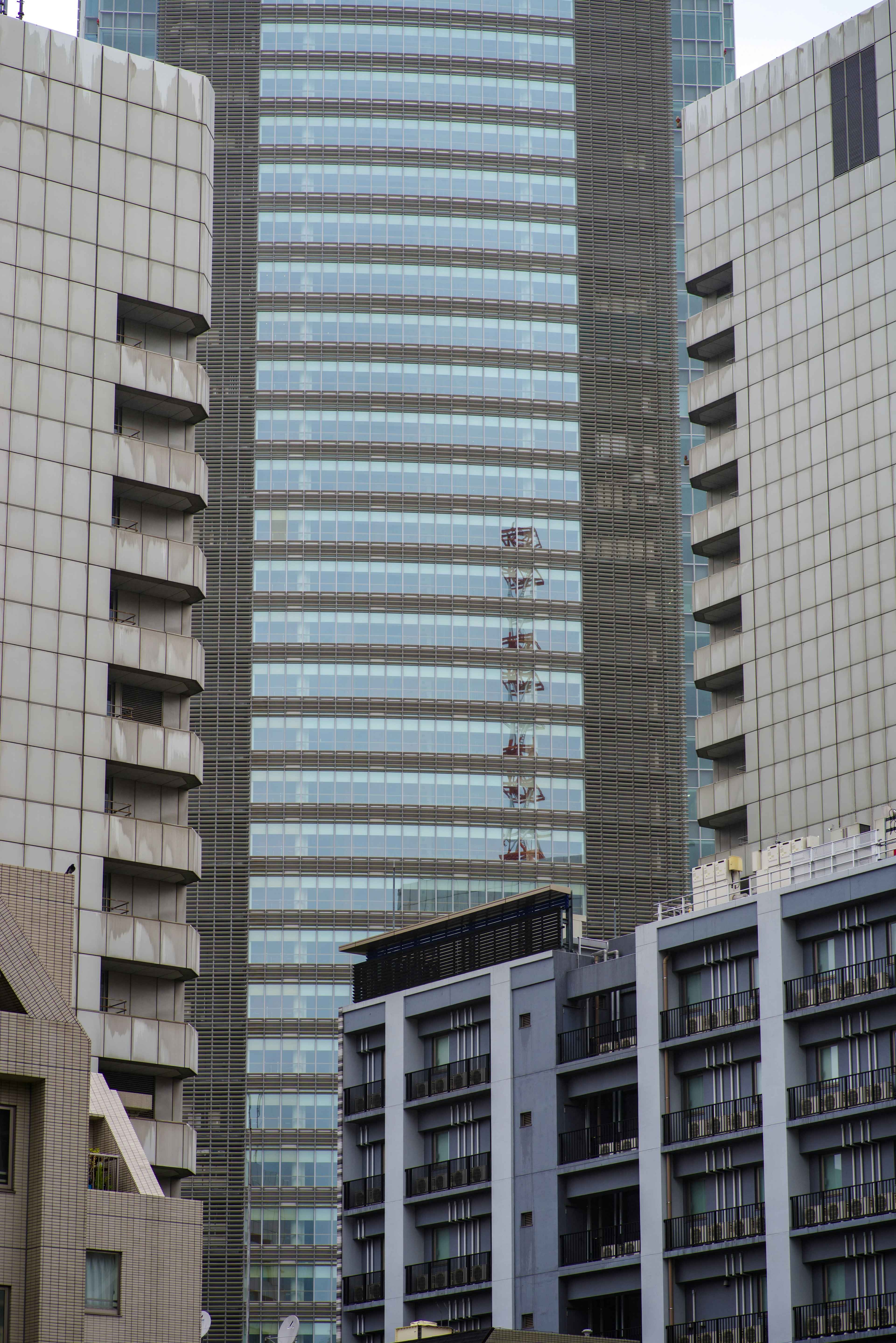 Photo of a modern building among high-rise structures