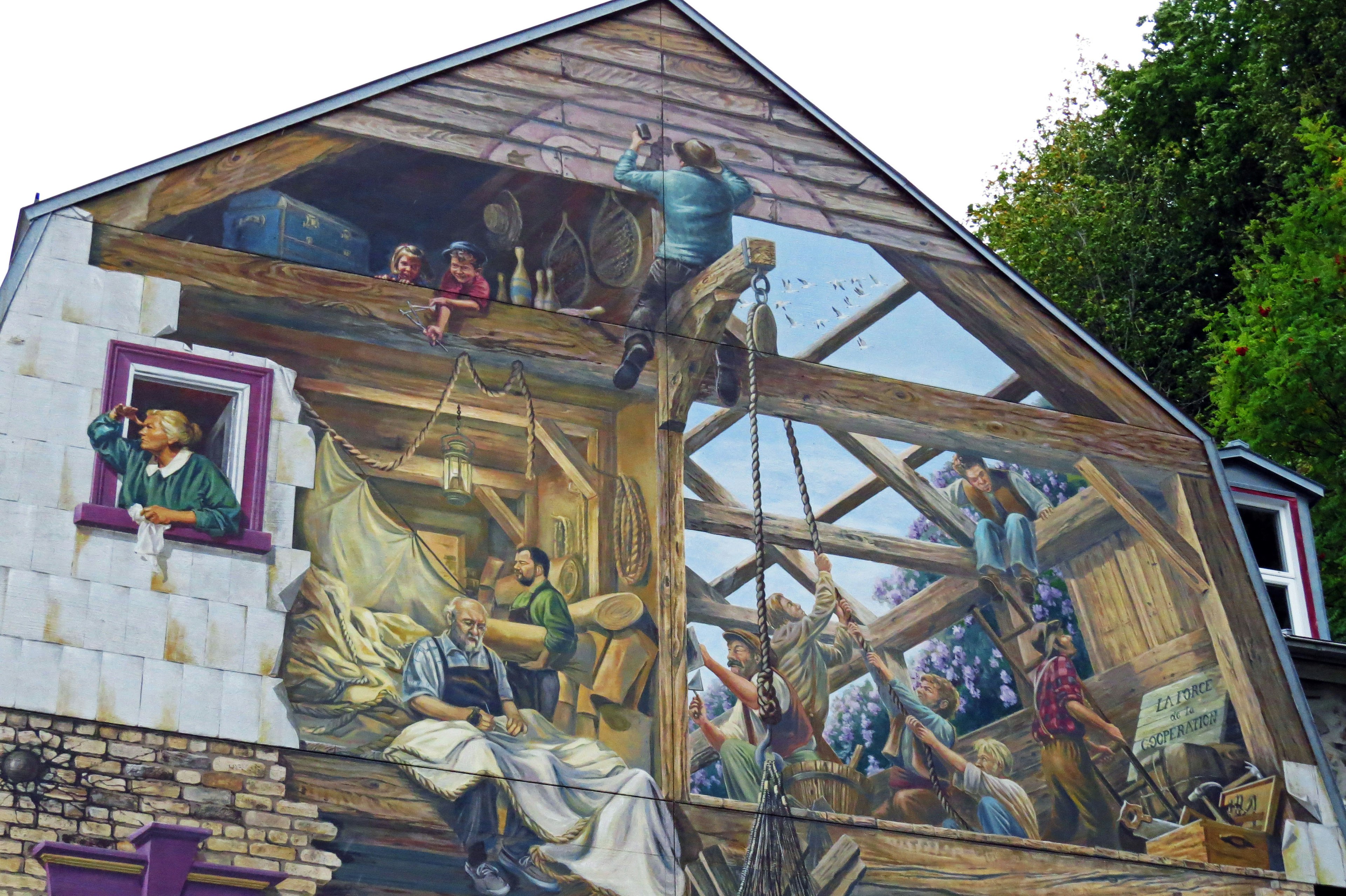 Mural depicting craftsmen repairing a roof with people working and a figure peeking from a window