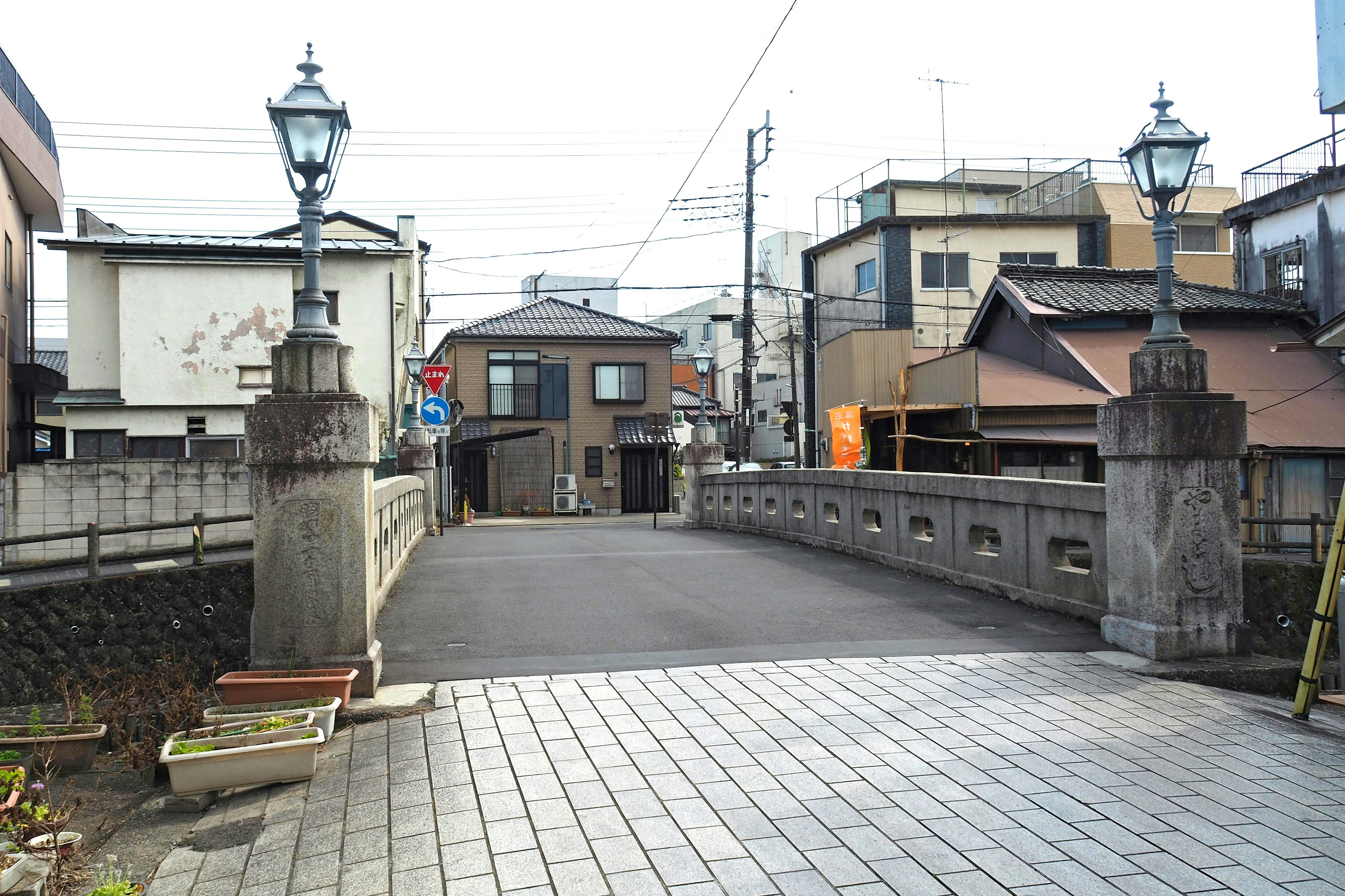 Stone bridge with old houses in the background