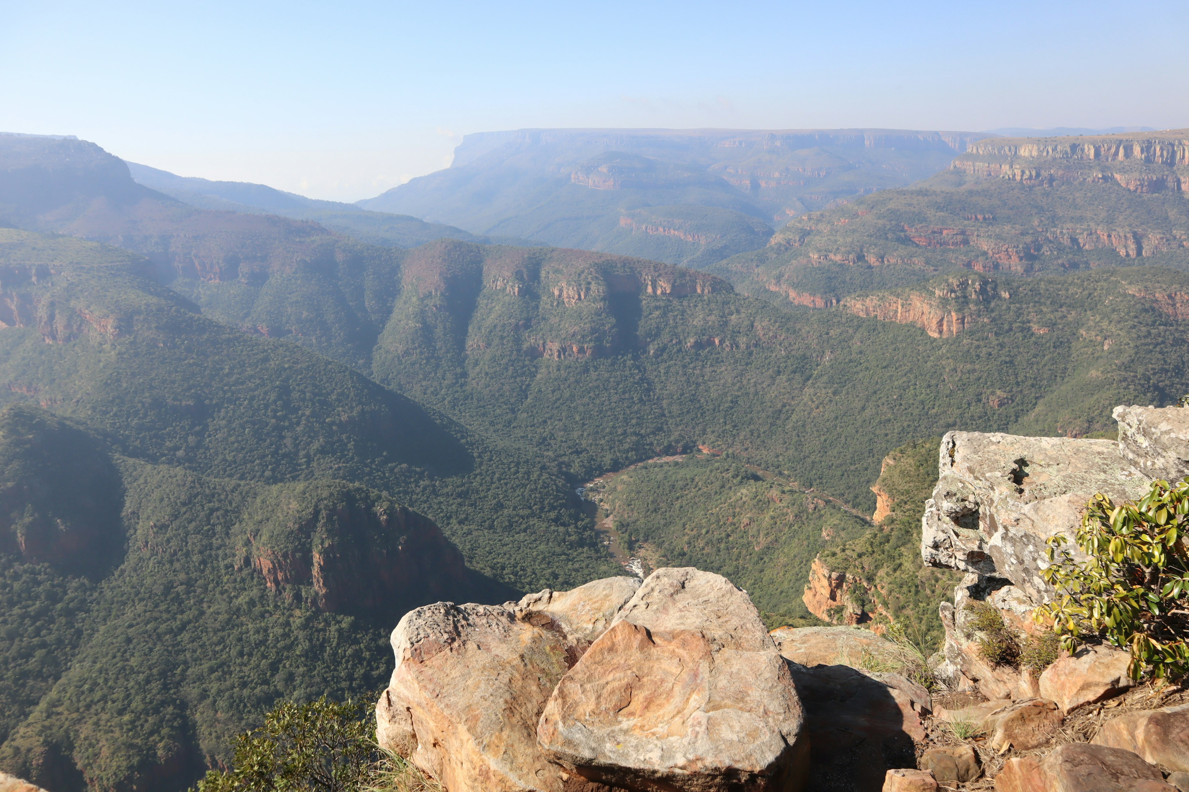 Lush green mountains and expansive valleys in a scenic landscape