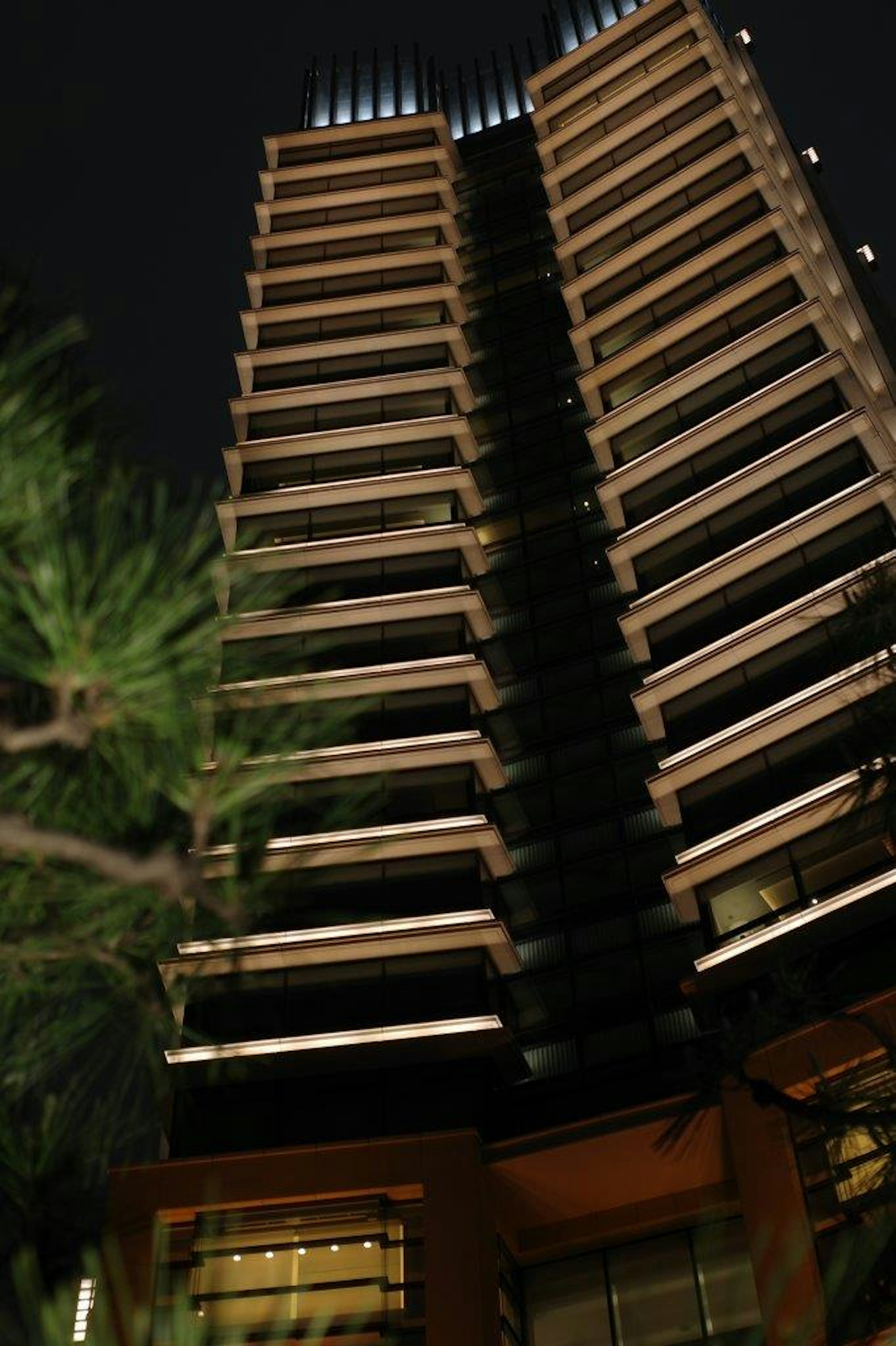 Modern high-rise building illuminated at night