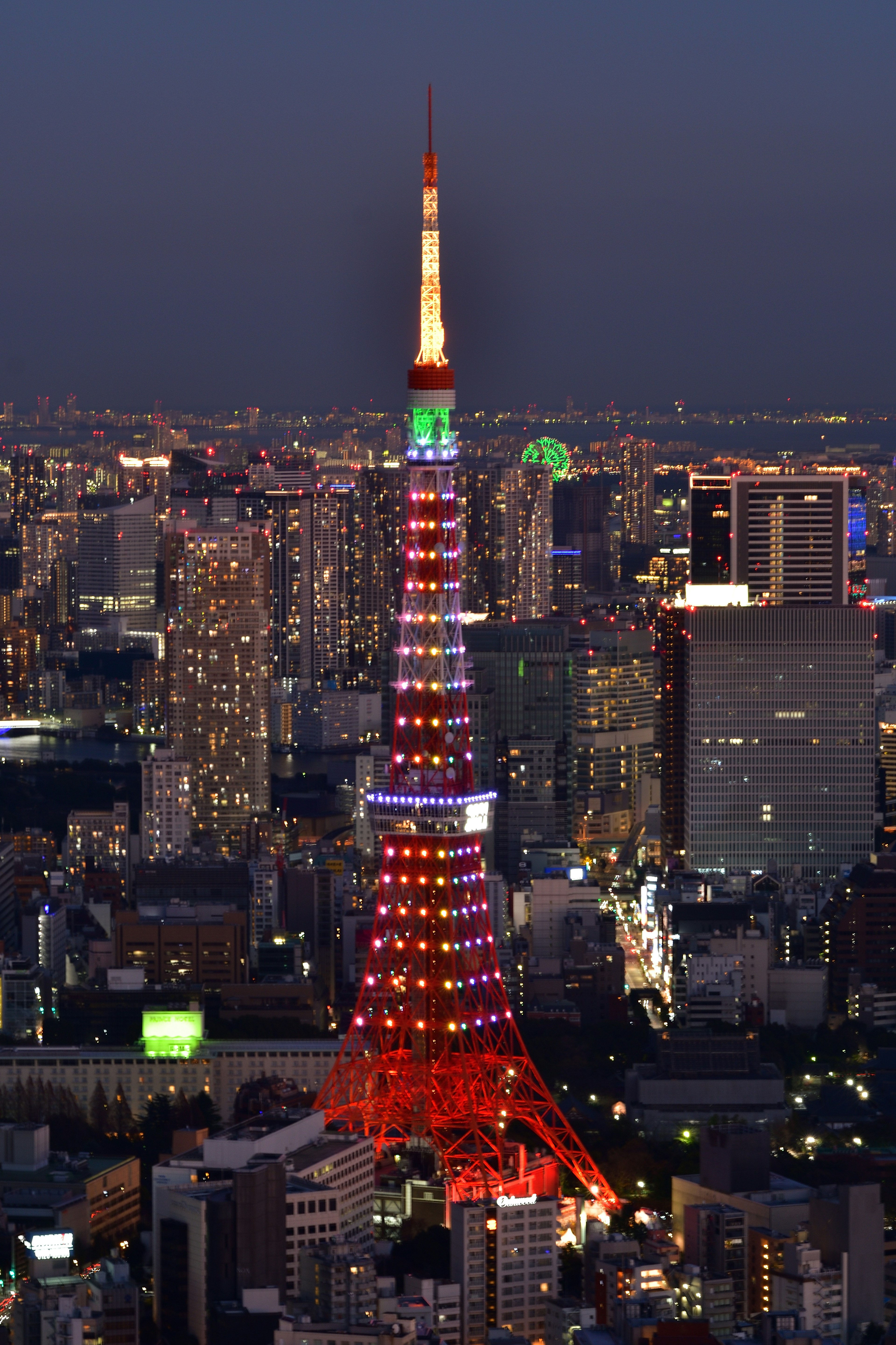 Tokyo Tower illuminated at night showcasing vibrant colors