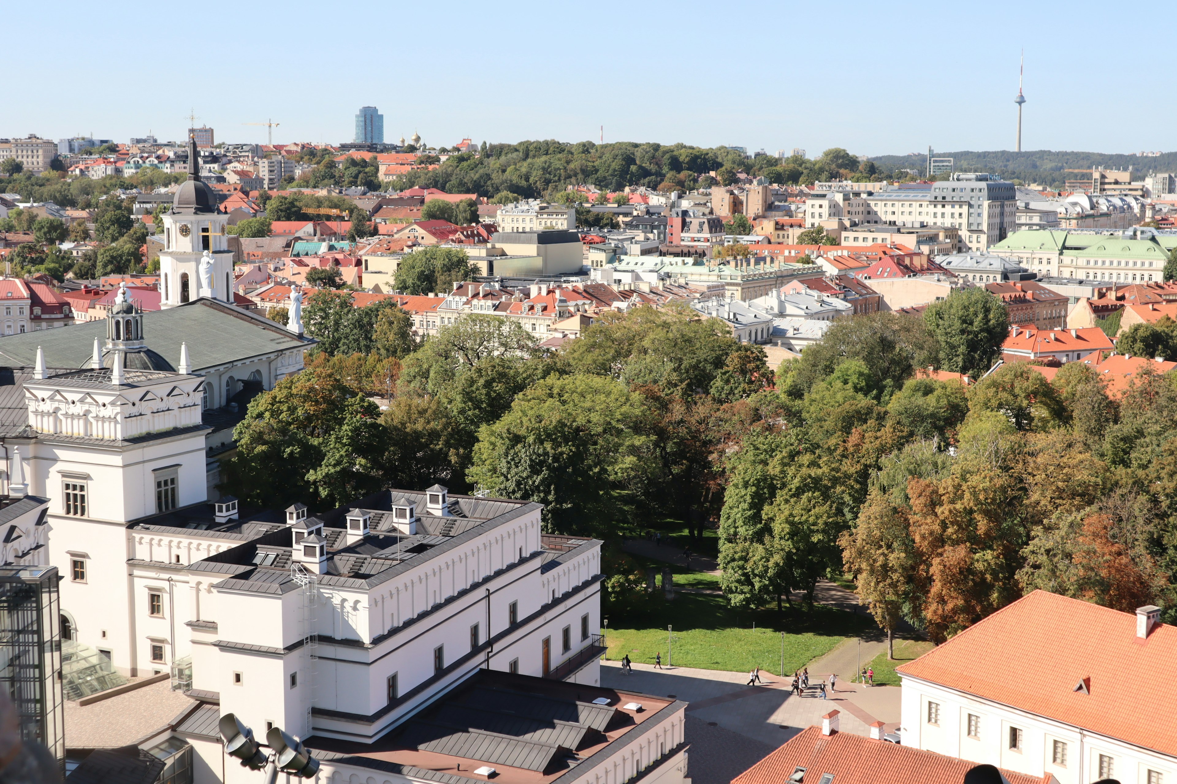 A panoramic view of Vilnius showcasing a mix of greenery and historical architecture