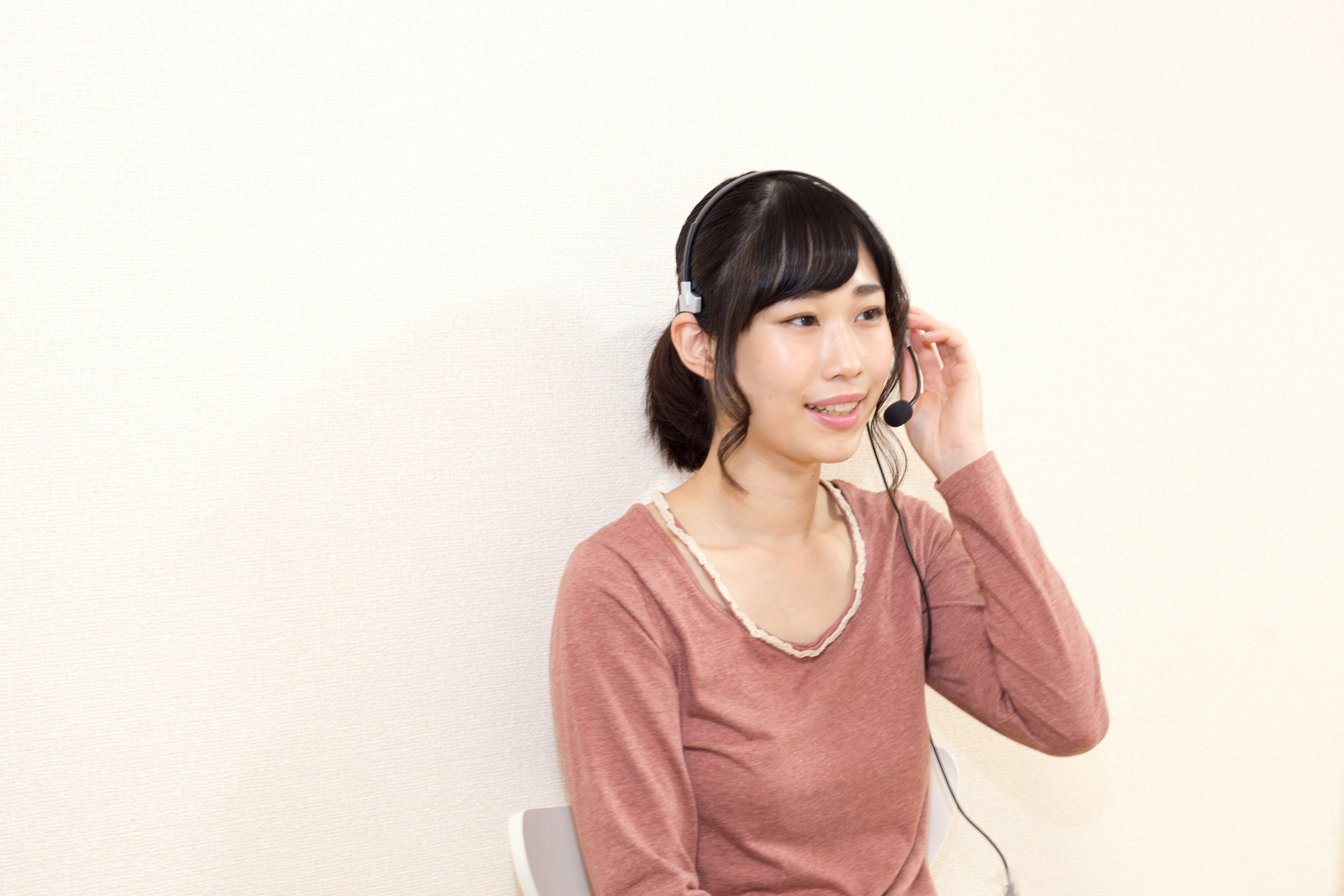 Woman smiling while wearing a headset